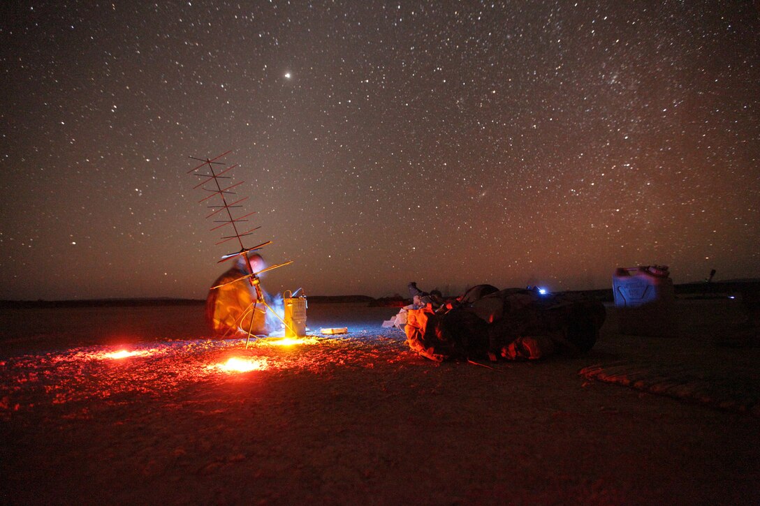 120212-M-OO345-208::r::::n::Mortarmen with Battalion Landing Team 3/1 set up radio communications Feb. 12 during training at a range here. The team serves as the ground combat element for the 11th Marine Expeditionary Unit. The unit is deployed as part of the Makin Island Amphibious Ready Group, a U.S. Central Command theater reserve force. The group is providing support for maritime security operations and theater security cooperation efforts in the U.S. Navy's 5th Fleet area of responsibility.