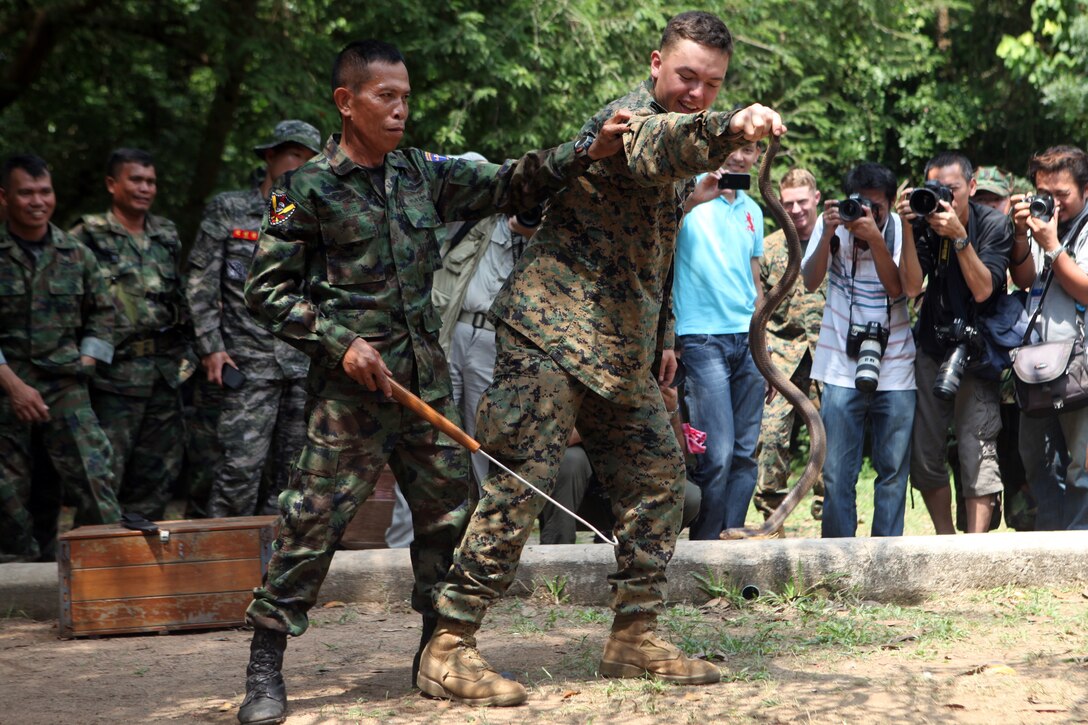 Sub-Lt. Pranom Yodrug, a Royal Thai reconnaissance Marine, slices a vegetable while teaching the Marines about edible vegetation as part of a jungle survival class held here, Feb. 13. The survival instruction, taught by members of the Royal Thai Marine Reconnaissance, educated U.S. and Republic of Korean Marines on finding sustenance and tools in the jungle environment. The class is part of exercise Cobra Gold 2012, now in its 31st iteration. The exercise is a multi-lateral event focused on strengthening the interoperability of all participating military forces. The 31st MEU is the only continuously forward-deployed MEU and remains the nation’s force in readiness in the Asia-Pacific region.