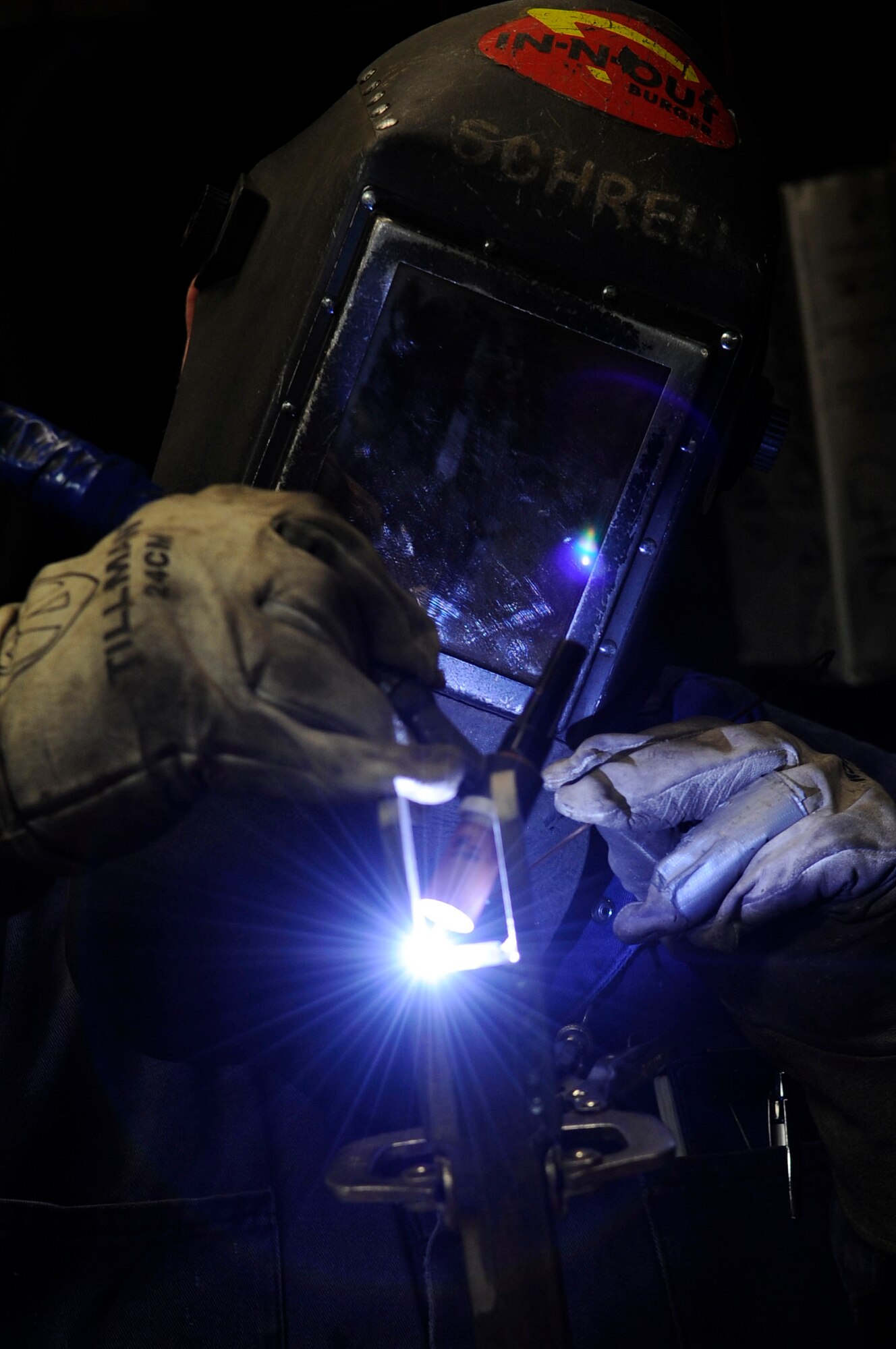 Richard Schrell, 354th Civil Engineer Squadron welder, builds a support bracket Feb. 8, 2012, Eielson Air Force Base, Alaska. The bracket will serve as a camera mount in the central heat and power plant coal bunker. (U.S. Air Force photo/Staff Sgt. Jim Araos)