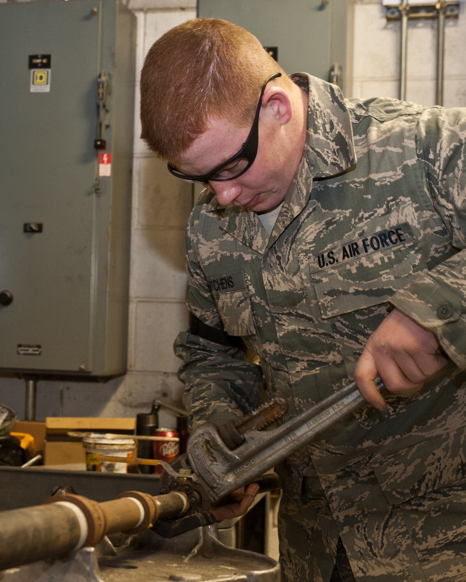 Senior Airman Justin Hutchens, 28th Civil Engineer Squadron heating and air conditioning technician, disassembles a gas pipe during a heating system installation at Ellsworth Air Force Base, S.D., Feb. 2, 2012. This 28th CES HVAC shop ensures that all buildings on Ellsworth meet work environment requirements, and provide a suitable work environment for all base personnel. (U.S. Air Force photo by Airman Alystria Maurer/Released)