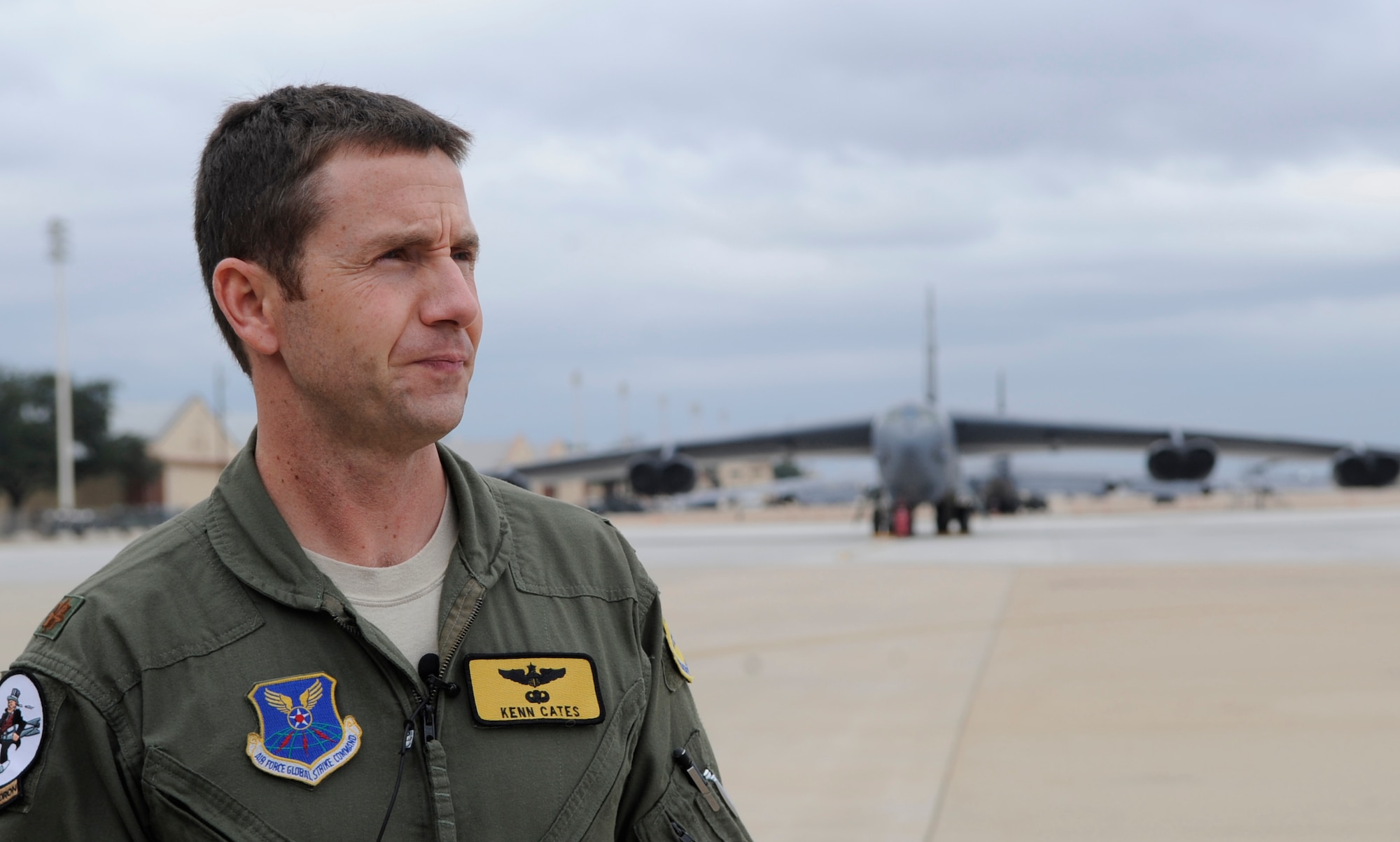 Maj. Ken Cates, 11th Bomb Squadron pilot, observes a B-52H Stratofortress on the flightline at Barksdale Air Force Base, La., Feb. 2. Cates volunteered to show two Greenacres Middle School students what life is like as a pilot. The students chose to learn about pilots. (U.S. Air Force photo/Airman 1st Class Andrea F. Liechti)(RELEASED)