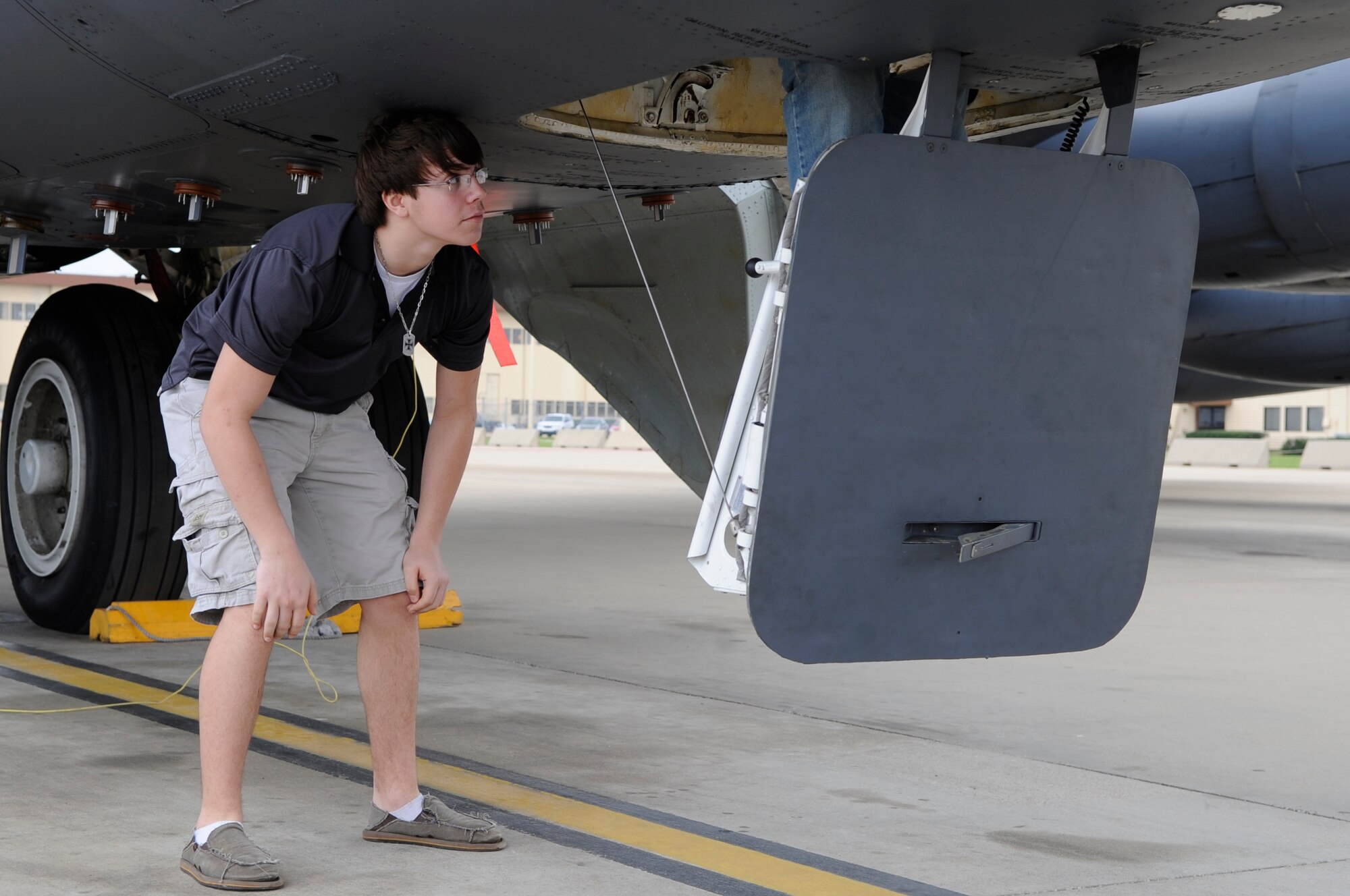 Nathan Naranjo, Greenacres Middle School student, waits for his turn to climb into a B-52H Stratofortress on the flightline at Barksdale Air Force Base, La., Feb. 2. Naranjo was given the opportunity to tour the base and learn everything he could from an 11th Bomb Squadron pilot. (U.S. Air Force photo/Airman 1st Class Andrea F. Liechti)(RELEASED)
