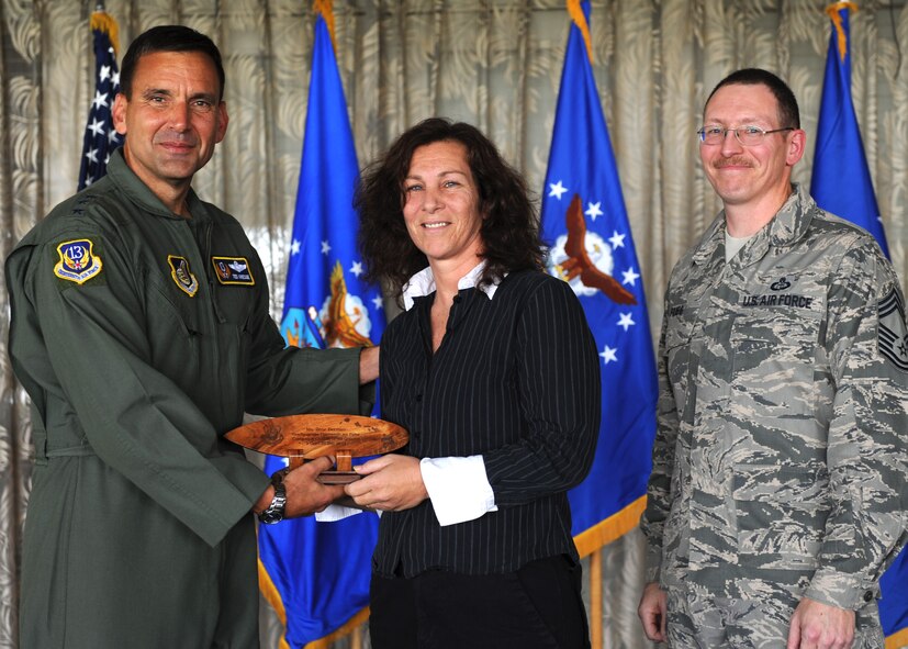 Lt. Gen. Ted Kresge, 13th Air Force Commander presents Ilene Berman, a 13th Air Force team member, with an award at the Hickam Officer's Club on Joint Base Pearl Harbor-Hickam, February 10.