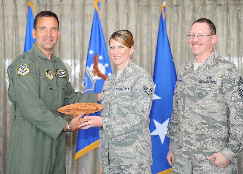 Lt. Gen. Ted Kresge, 13th Air Force Commander presents Staff Sgt Amy Stacey, a 13th Air Force team member, with an award at the Hickam Officer's Club on Joint Base Pearl Harbor-Hickam, February 10.