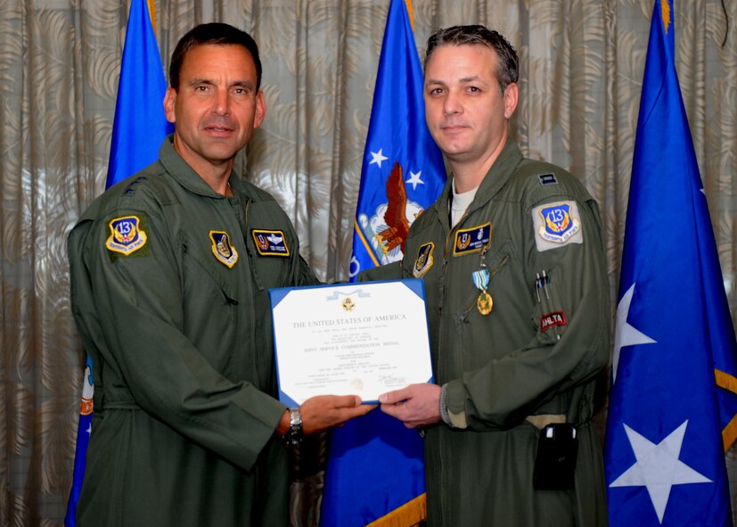 Lt. Gen. Ted Kresge, 13th Air Force Commander presents Capt John Michael Fowler, a 13th Air Force team member, with a medal and citation at the Hickam Officer's Club on Joint Base Pearl Harbor-Hickam, February 10.