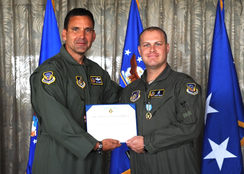 Lt. Gen. Ted Kresge, 13th Air Force Commander presentsMaj Aaron Fields, a 13th Air Force team member, with a medal and citation at the Hickam Officer's Club on Joint Base Pearl Harbor-Hickam, February 10.