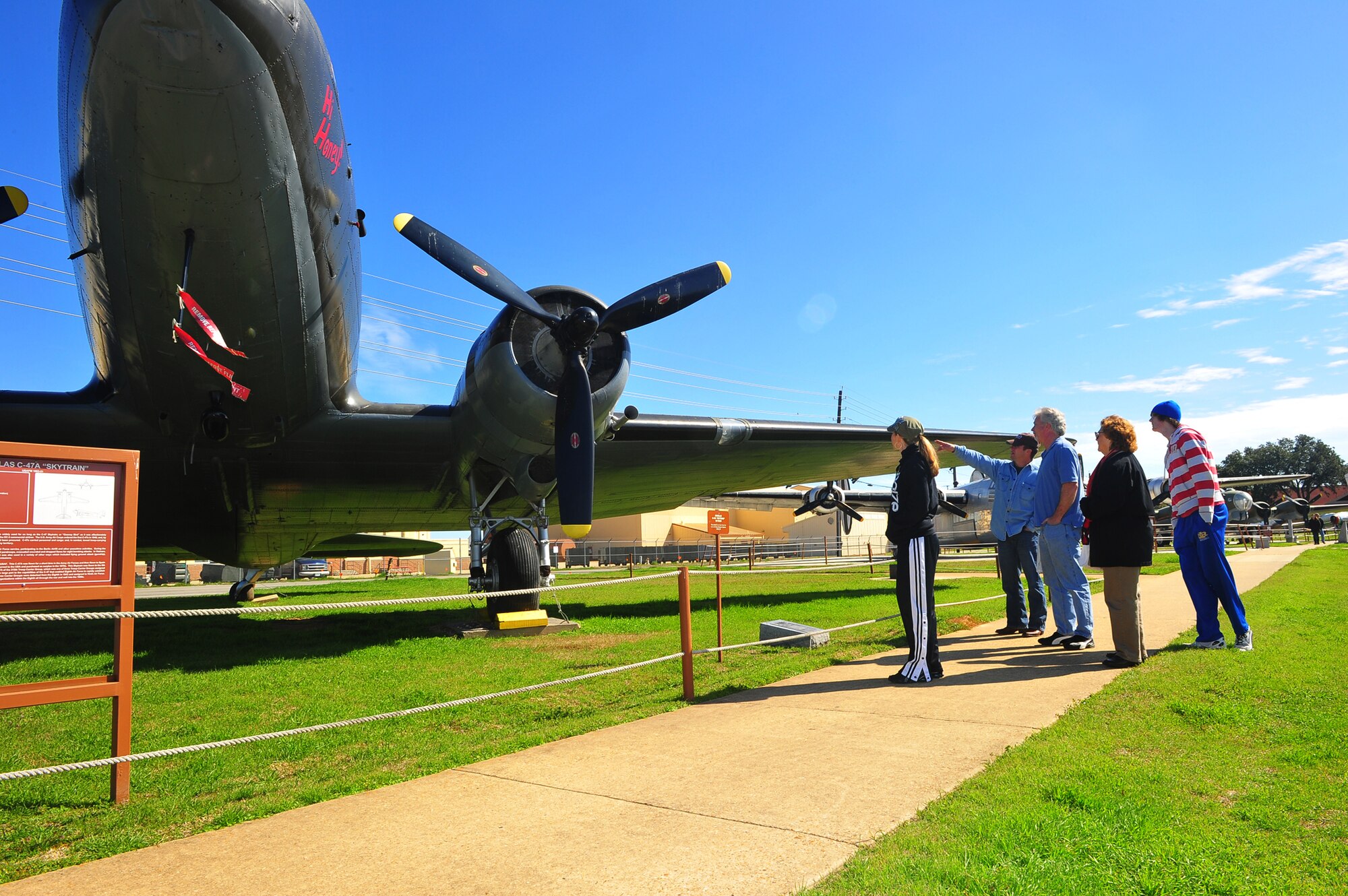 Visitors to the 8th Air Force Museum look at the C-47A Skytrain static aircraft display Feb. 12, at Barksdale Air Force Base, La. The museum sees several thousand visitors every year. Repair and maintenance for the displays are funded by donations and fundraising efforts by the 8th Air Force Museum Association. (U.S. Air Force photo/Tech. Sgt. Mike Andriacco)(Released)