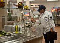 U.S. Air Force Master Sgt. Nichelle Jenkins, Headquarters Air Force Services Agency at Lackland Air Force Base, Texas, checks service-line food items during the John L. Hennessy award inspection at the Georgia Pines Dining Facility, Feb. 10, 2012, at Moody Air Force Base, Ga. The 23d Force Support Squadron will receive the results of their inspection by the end of the month. . (U.S. Air Force photo by Senior Airman Eileen Meier/Released)