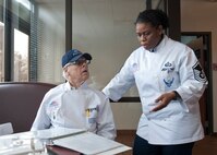 David Stockman, National Restaurant Association, and U.S. Air Force Master Sgt. Nichelle Jenkins, Headquarters Air Force Services Agency at Lackland Air Force Base, Texas, discuss and review inspection items during a John L. Hennessy award inspection at the Georgia Pines Dining Facility Feb. 10, 2012, at Moody Air Force Base, Ga. The inspectors reviewed the facility’s customer service, food quality, facility maintenance and compliance with safety guidelines. (U.S. Air Force photo by Senior Airman Eileen Meier/Released)