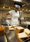 U.S. Air Force Senior Airman Tanica Case, 23d Force Support Squadron, makes sandwiches in preparation for lunch during an Air Force-level John L. Hennessy award inspection at the Georgia Pines Dining Facility, Feb. 10, 2012, at Moody Air Force Base, Ga. The Hennessy award honors the Air Force’s top food service  programs. (U.S. Air Force photo by Senior Airman Eileen Meier/Released)
