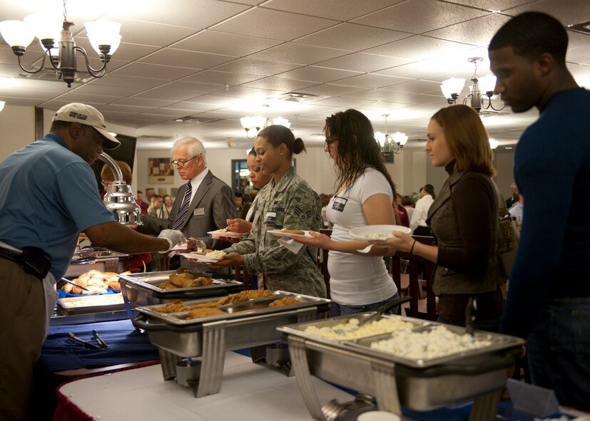 Members of Team Moody gather for an ice-breaker dinner social at the Georgia Pines Dining Facility, Feb. 9, 2012, at Moody Air Force base, Ga. During a recent visit from U.S. Maj. Gen. Lawrence Wells, 9th Air Force commander, the 23d Force Support Squadron dining facility found out they won the Air Combat Command-level John L. Hennessy award. They are currently competing at the Air Force level. (U.S. Air Force photo by Senior Airman Eileen Meier/Released)