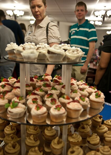 Cupcakes made using the winning recipes from the recent Cupcake Wars event sit on display during an ice-breaker dinner social with members of Team Moody and the John L. Hennessy award inspectors at the Georgia Pines Dining Facility, Feb. 9, 2012, at Moody Air Force Base, Ga. The 23d Force Support Squadron is currently competing for the Air Force-level Hennessy award after winning the best multiple-facility dining facility for Air Combat Command. (U.S. Air Force photo by Senior Airman Eileen Meier/Released) 
