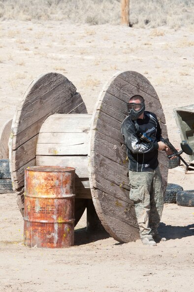 HOLLOMAN AIR FORCE BASE, N.M. – A resident of Holloman’s dormitories takes cover during an Outdoor Recreation Center paintball tournament at the paintball fields here Feb. 11. The tournament was in support of the Air Force’s Single Airmen Initiative program, which is designed to sponsor activities and programs to meet the needs and interests of the Airmen community, boost morale, and improve the quality of life for Holloman’s Airmen. (U.S. Air Force photo by Airman 1st Class Anthony M. Ward/Released)