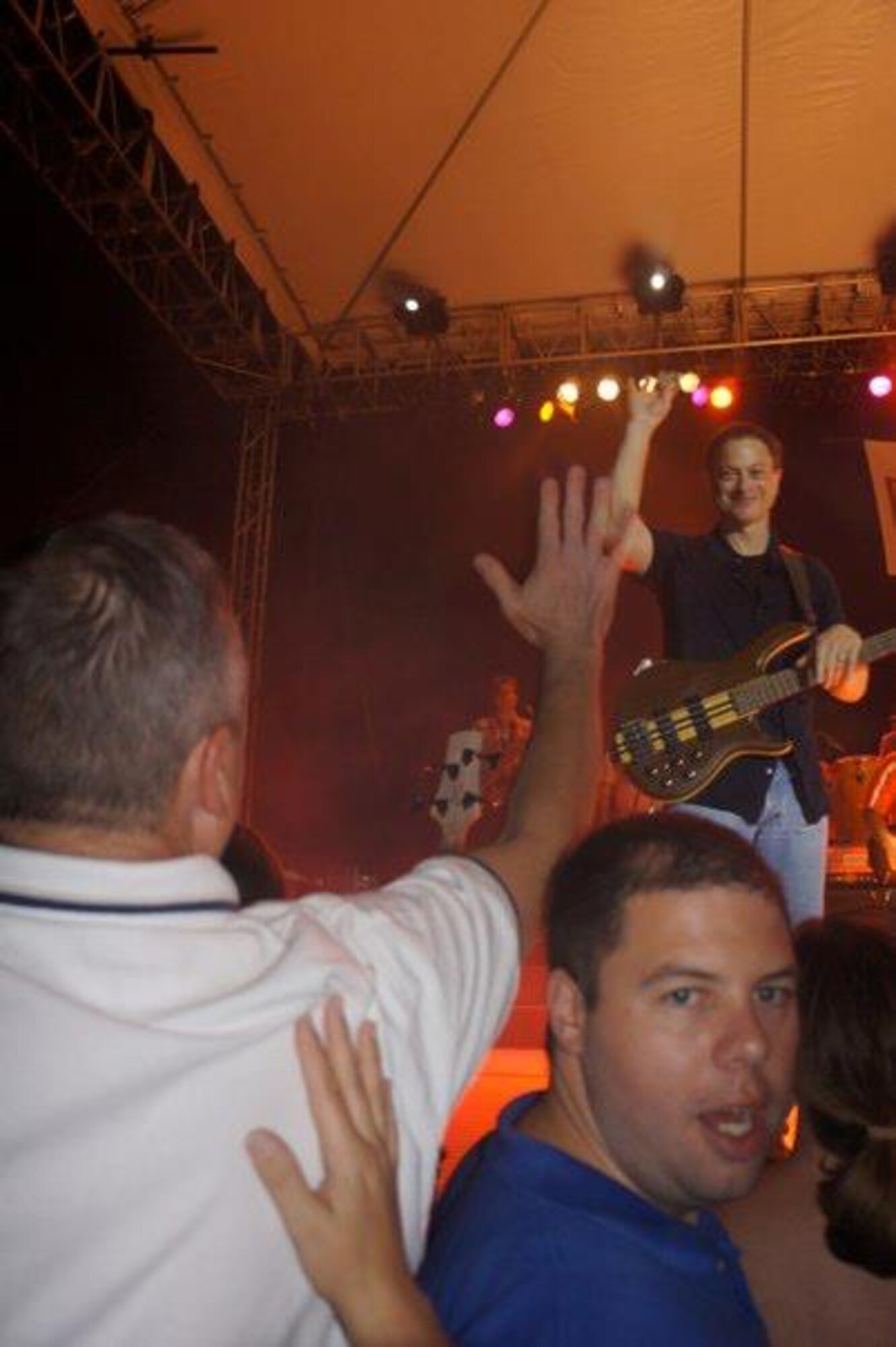 Gary Sinise, bass guitarist for the Lt. Dan Band, thanks Hickam and Pearl Harbor service members after receiving a 13th Air Force coin during a concert at the Freedom Tower Feb. 10. Sinise is widely known for he character "Lt. Dan" he portrayed in the 1994 Academy Award winning film, Forrest Gump, in which he got an Oscar nomination for Best Supporting Actor. (U.S. Air Force Photo)