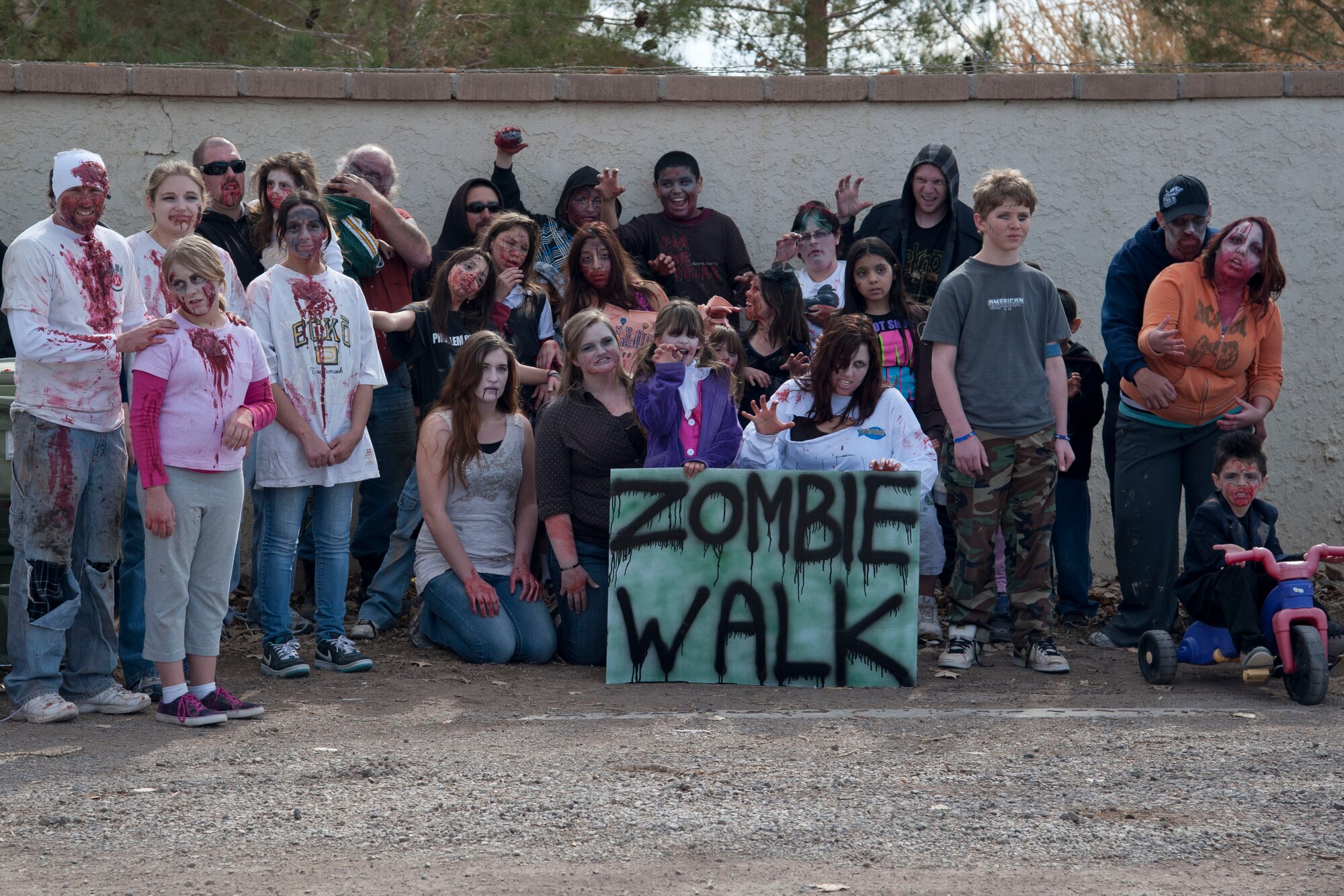 HOLLOMAN AIR FORCE BASE, N.M. – Airmen and Alamogordo residents, all participants of the Alamogordo Zombie Walk, pose for a group photo in downtown Alamogordo Feb. 4. The event was in celebration of “Night of the Living Dead” director George A. Romero’s birthday, and was the first of its kind for the Holloman and Alamogordo communities. (U.S. Air Force photo by Airman 1st Class Anthony M. Ward/Released)