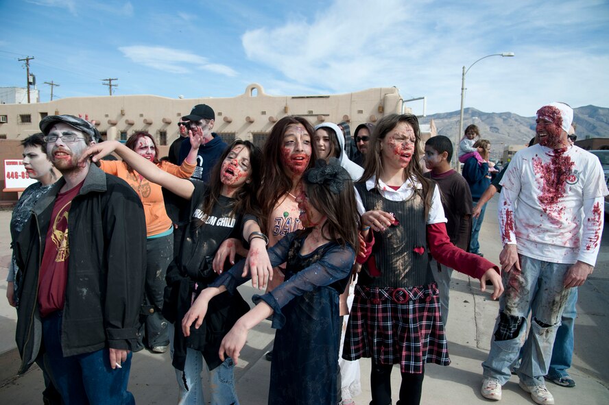 HOLLOMAN AIR FORCE BASE, N.M. – Members of the Holloman and Alamogordo communities participate in the Alamogordo Zombie Walk adorned in attire suited for victims of the walking dead in downtown Alamogordo Feb. 4. The event was in celebration of “Night of the Living Dead” director George A. Romero’s birthday, and was the first of its kind for the Holloman and Alamogordo communities. (U.S. Air Force photo by Airman 1st Class Anthony M. Ward/Released)