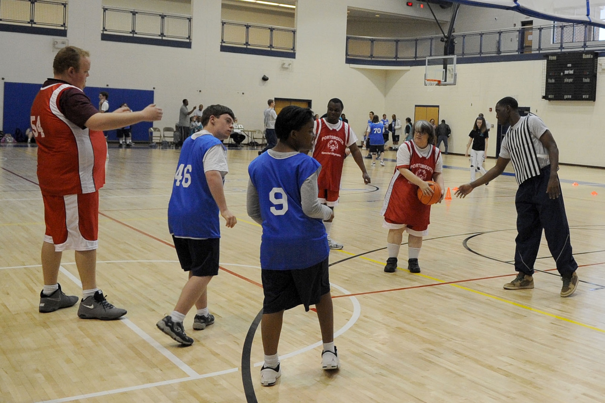 U.S. Air Force Senior Airman Arsenio Jones, 633rd Medical Operations Squadron, referees a Special Olympics basketball game at Langley Air Force Base, Va., Feb. 11, 2012. The basketball teams were grouped into competition divisions according to the athletes' and team's ability level. (U.S. Air Force photo by Airman 1st Class Racheal Watson/Released)