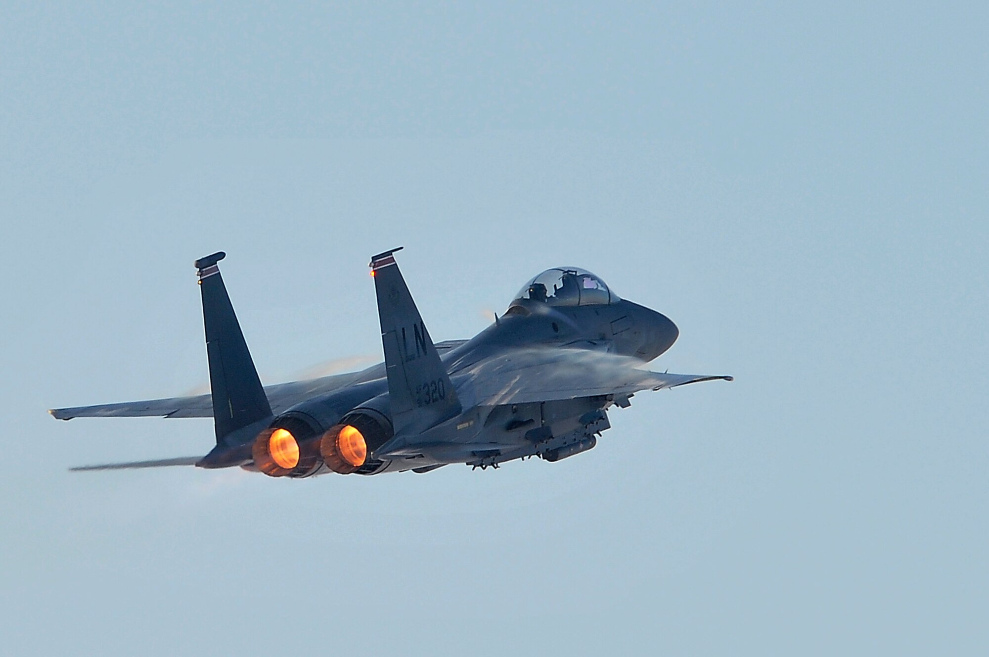 ROYAL AIR FORCE LAKENHEATH, England -- An F-15E Strike Eagle from the 48th Fighter Wing blazes through the sky during a 20th anniversary commemoration event, Feb. 10, 2012.  The first F-15E arrived to Lakenheath on Feb. 21, 1992 and has supported numerous U.S and NATO missions from Operation Provide Comfort in 1993 to Operations Odyssey Dawn and Unified Protector in 2011. The F-15E is a dual-role fighter designed to perform air-to-air and air-to-ground missions. An array of avionics and electronics systems gives the F-15E the capability to fight at low altitude, day or night, and in all weather.  (U.S. Air Force photo by Staff Sgt. Conner Estes)