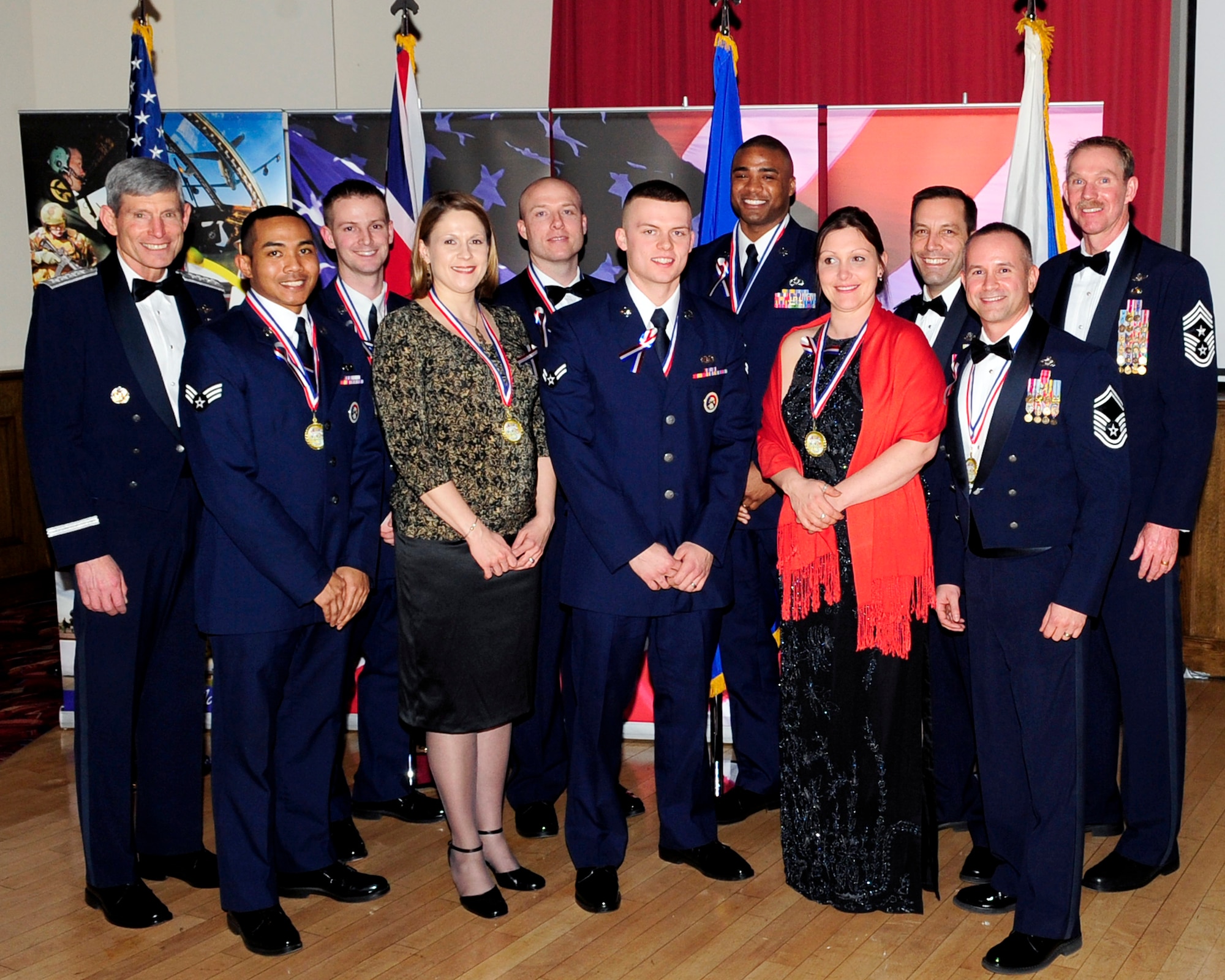 RAF MILDENHALL, England - Air Force Chief of Staff Gen. Norton Schwartz poses for a group photo with the 2011 Team Mildenhall annual award winners during the Annual Awards Banquet here Feb. 10, 2012. Also in the photo are Col. Christopher Kulas, 100th Air Refueling Wing commander, and Chief Master Sgt. Chris Powell, 100th ARW command chief. The winners were Airman 1st Class Orson Lyttle, Senior Airmen Leroy Jackson and Patrick Flynn; Staff Sgt. Byron Washington, Master Sgt. Thomas Wagner, Senior Master Sgt. Emilio
Hernandez, Capt. Nathaniel Smith, Mia Tobitt and Danielle Poyant. (U.S. Air Force photo/Senior Airman Ethan Morgan)
