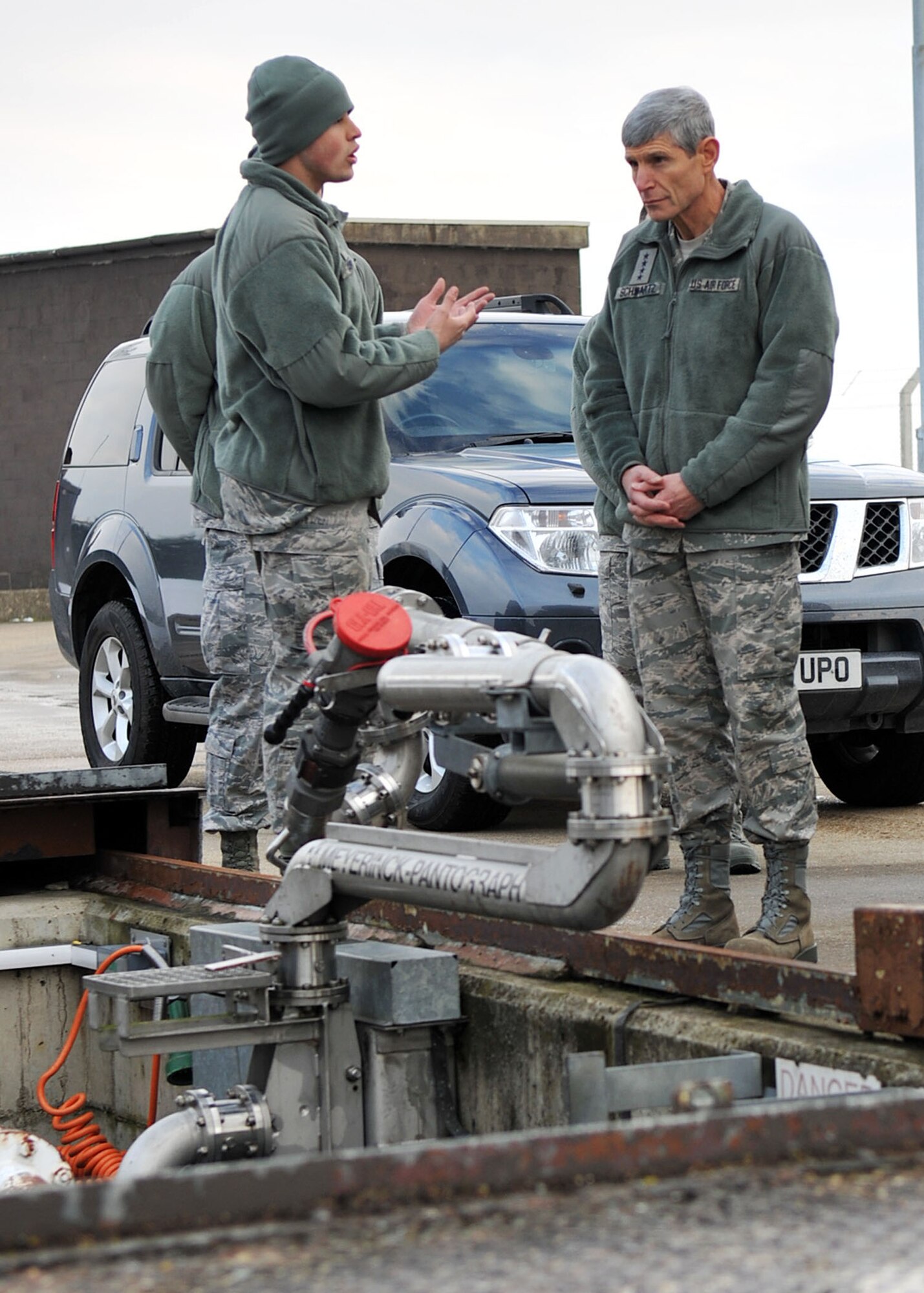 RAF MILDENHALL, England - Airman 1st Class Anthony Carter, 100th Logistics Readiness Squadron, briefs Air Force Chief of Staff Gen. Norton Schwartz during a tour of the Petroleum Storage Installation here Feb. 10, 2012. Schwartz also visited RAF Lakenheath and served as guest speaker at the annual awards ceremonies for both bases. (U.S. Air Force photo/Senior Airman Jerilyn Quintanilla)
