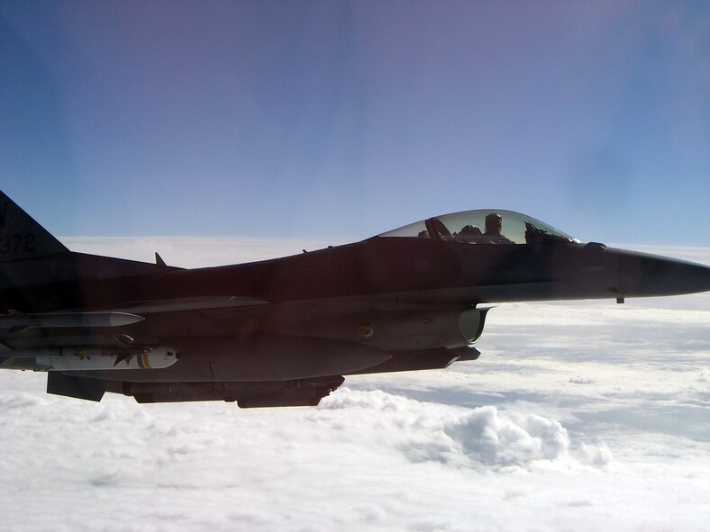 A U.S. Air Force F-16 Fighting Falcon, equipped with a product dispenser unit-5 leaflet bomb, from the 20th Fighter Wing patrols the sky over Libya during Operation Unified Protector. The 20th FW had the unique role of dropping leaflet bombs to give NATO messages for the safety of Libyan civilians. (U.S. Air Force courtesy photo/Released)