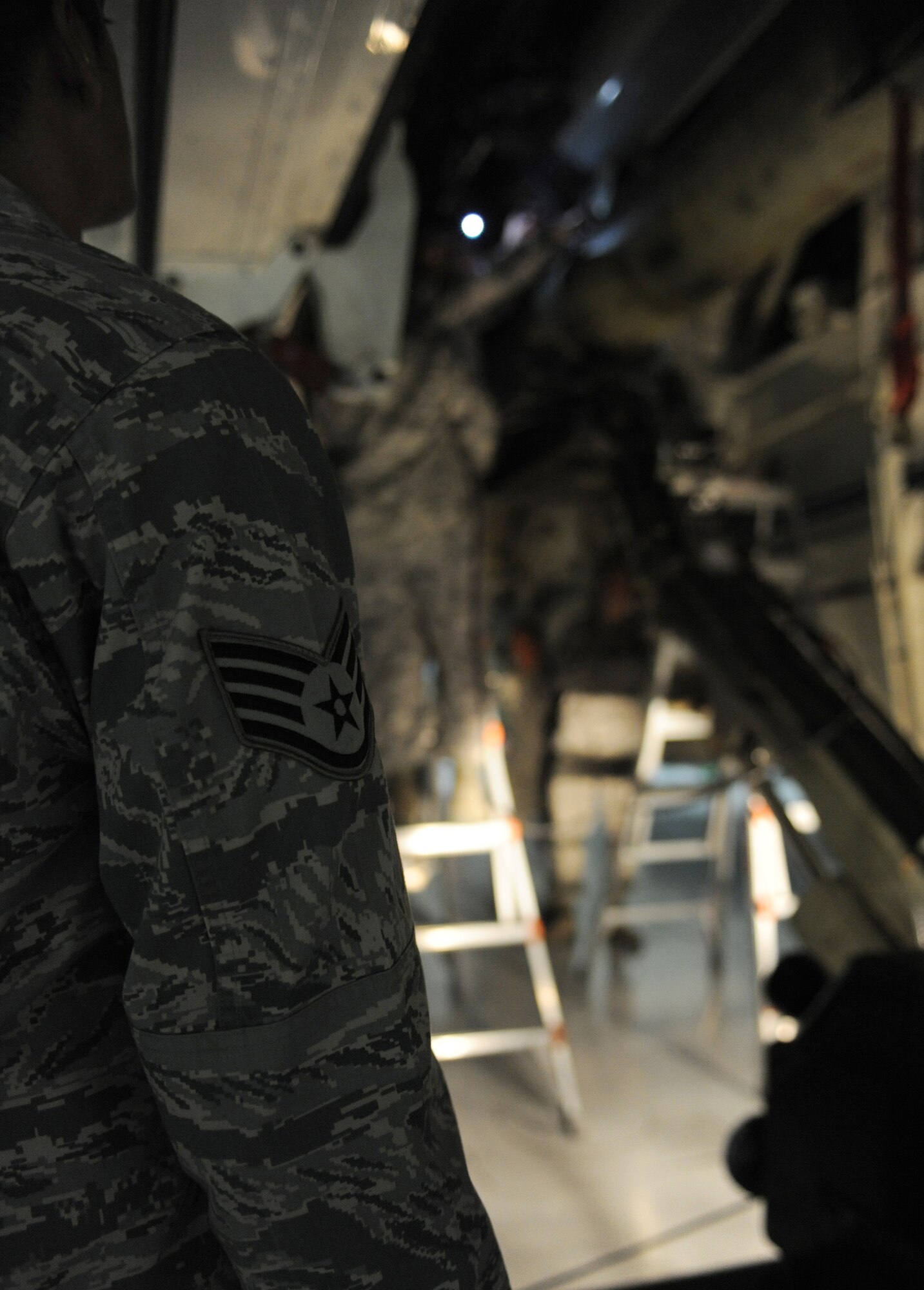 WHITEMAN AIR FORCE BASE, Mo. -- Staff Sergeant Ricardo Zuniga evaluates weapons Airmen during the annual 509th Aircraft Maintenance Squadron?s weapons load crew competition Feb. 3. The competition is scored in four different areas to include dress and appearance, composite tool kit inspection, a written test, and a loading evaluation. To be eligible to compete the crews must have a zero deficiencies and must win Load Crew of the Quarter. Zuniga is assigned to the 509th AMXS. (U.S. Air Force photo/Senior Airman Laura Goodgame) 