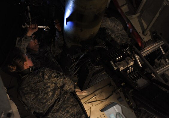 WHITEMAN AIR FORCE BASE, Mo. -- Staff Sergeant Richard Rivera wrenches a screw into place during an annual weapons load crew of the year competition Feb. 3. The competition is scored in four different areas to include dress and appearance, composite tool kit inspection, a written test, and a loading evaluation. To be eligible to compete the crews must have a zero deficiencies and must win Load Crew of the Quarter. Rivera is a weapons Airman assigned to the 509th Aircraft Maintenance Squadron.  (U.S. Air Force photo/Senior Airman Laura Goodgame) 