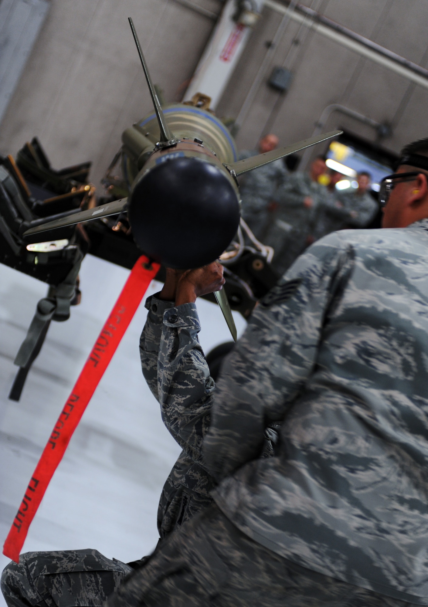 WHITEMAN AIR FORCE BASE, Mo. -- A weapons crew Airman assemble an inert GBU 28-C/B bomb during the annual load crew of the year competition Feb. 3. The competition is amongst the top three weapons crews with the best year long statistics. The Airmen are assigned to the 509th Aircraft Maintenance Squadron. (U.S. Air Force photo/Senior Airman Laura Goodgame) 