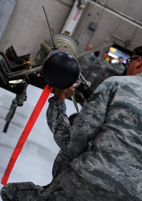 WHITEMAN AIR FORCE BASE, Mo. -- A weapons crew Airman assemble an inert GBU 28-C/B bomb during the annual load crew of the year competition Feb. 3. The competition is amongst the top three weapons crews with the best year long statistics. The Airmen are assigned to the 509th Aircraft Maintenance Squadron. (U.S. Air Force photo/Senior Airman Laura Goodgame) 