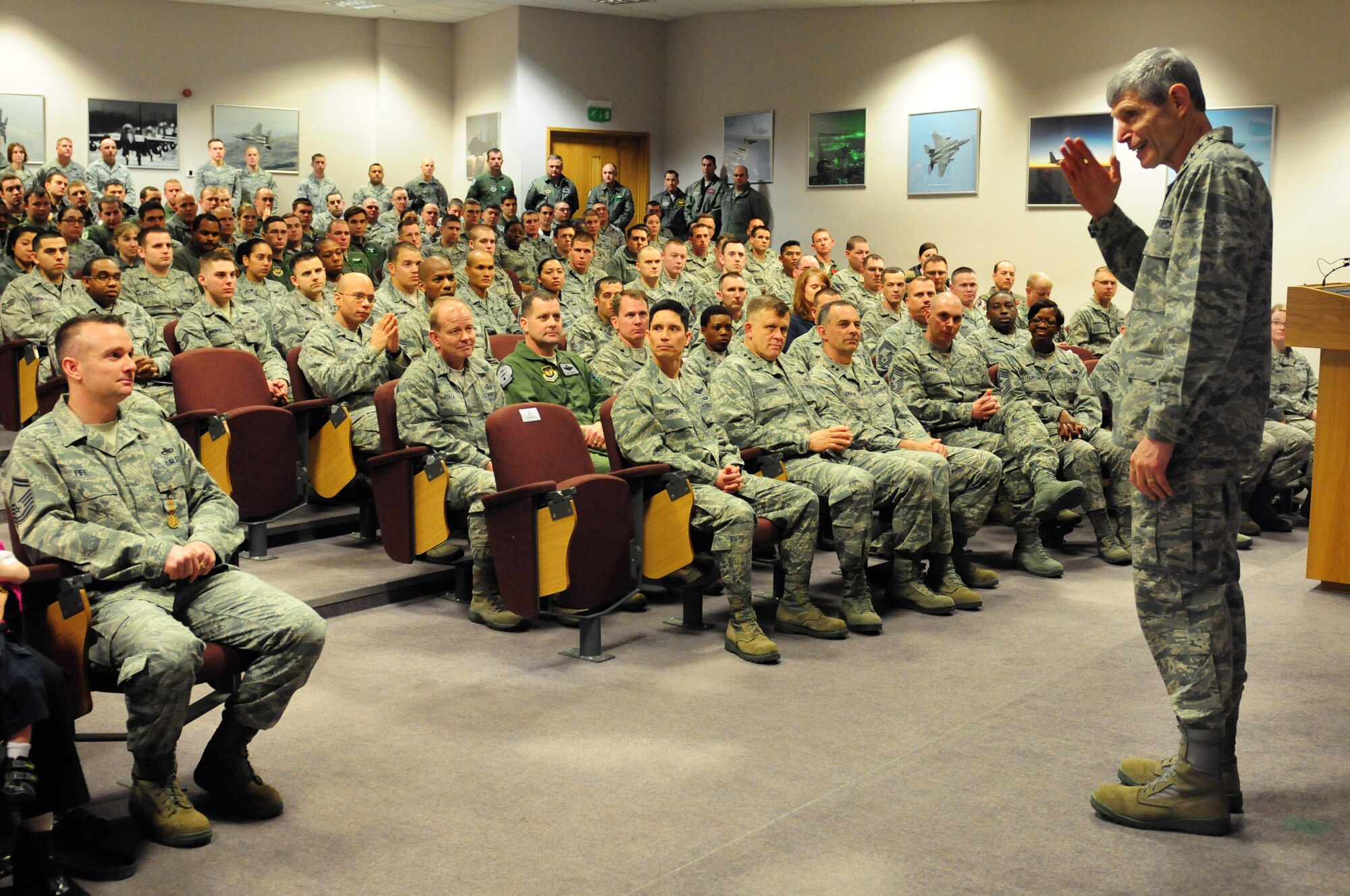ROYAL AIR FORCE LAKENHEATH, England -- Air Force Chief of Staff Gen. Norton Schwartz, salutes Liberty Warriors during an awards presentation at the Strike Eagle Complex Feb. 10, 2012. Schwartz presented five Liberty Warriors with medals for demonstrating bravery and heroism in the line of duty. (U.S. Air Force photo by Senior Airman Lausanne Morgan)