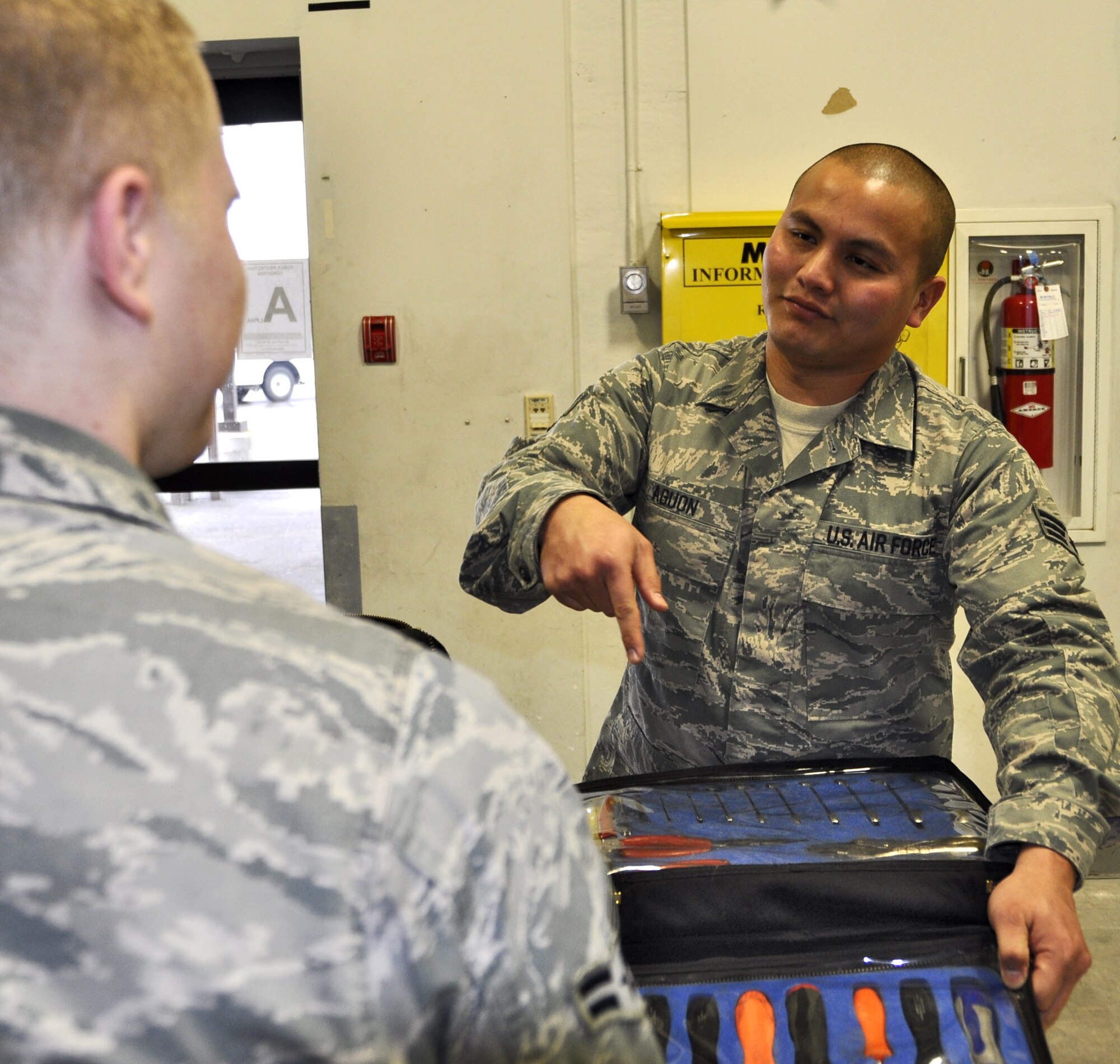Staff Sgt. Frances Aguan (then Senior Airman), 446th Aircraft Maintenance Squadron, receives tools at McChord Field, Wash., Feb. 11, 2012. Aguan is a 2011 recipient of the Lieutenant General Leo Marquez Award in the Aircraft Maintenance category. (U.S. Air Force photo/Staff Sgt. Rachael Garneau)