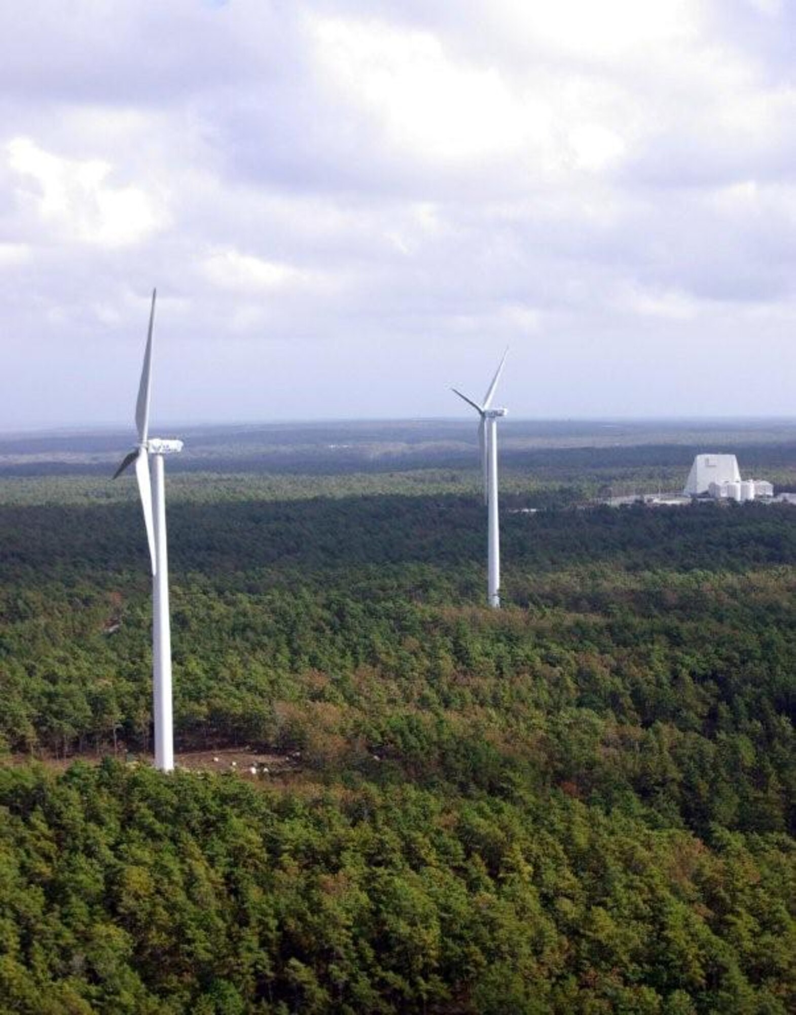 Two 1.6 megawatt wind turbines, similar to the ones pictured, are planned to offset nearly 50 percent of Cape Cod AFS energy consumption. The turbines will stand almost 400 feet tall and provide clean, renewable power for the installation. (U.S. Air Force photo)