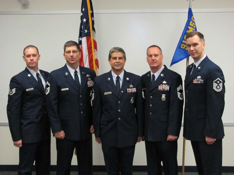 Master Sgt. Timothy Murdock (center) stands with Staff Sgt Ajinga (far left), Senior Master Sgt. Knuth (left), Chief Willis (right) and Master Sgt. Harris (far right).during his retirement ceremony during the February drill weekend. Murdoch served 20 years as a firefighter with 16 years of service with the 916th Fire Department. (USAF courtesy photo 916CEF).