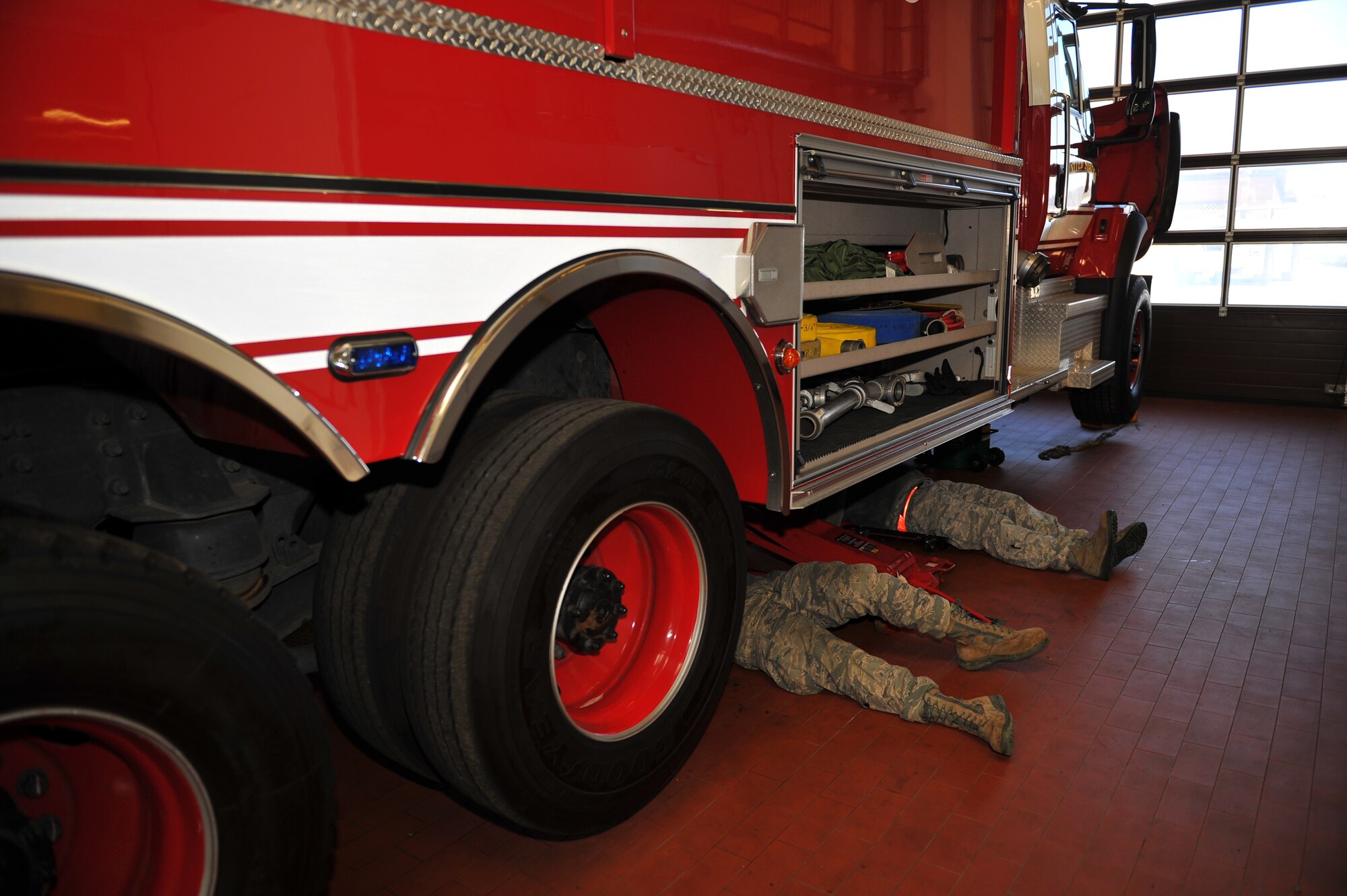 SPANGDAHLEM AIR BASE, Germany – Vehicle maintenance technicians assigned to the 52nd Logistics Readiness Squadron rebuild a transfer case on a P26 Tanker Truck inside the fire truck maintenance shop here Feb. 10. The transfer case is essential to the operation of the P26 Tanker Truck because it’s the gear box that transfers power from the transmission to the front and rear wheels enabling the truck to drive in extreme weather conditions. The fire truck maintenance shop consists of 12 technicians and is responsible for the maintenance of more than 50 heavy equipment vehicles such as fire trucks, aircraft deicers and aircraft load equipment. Technicians assigned to the fire truck maintenance shop ensure daily operations continue even when fire or ice present potential hindrances. (U.S. Air Force photo by Airman 1st Class Dillon Davis/Released)