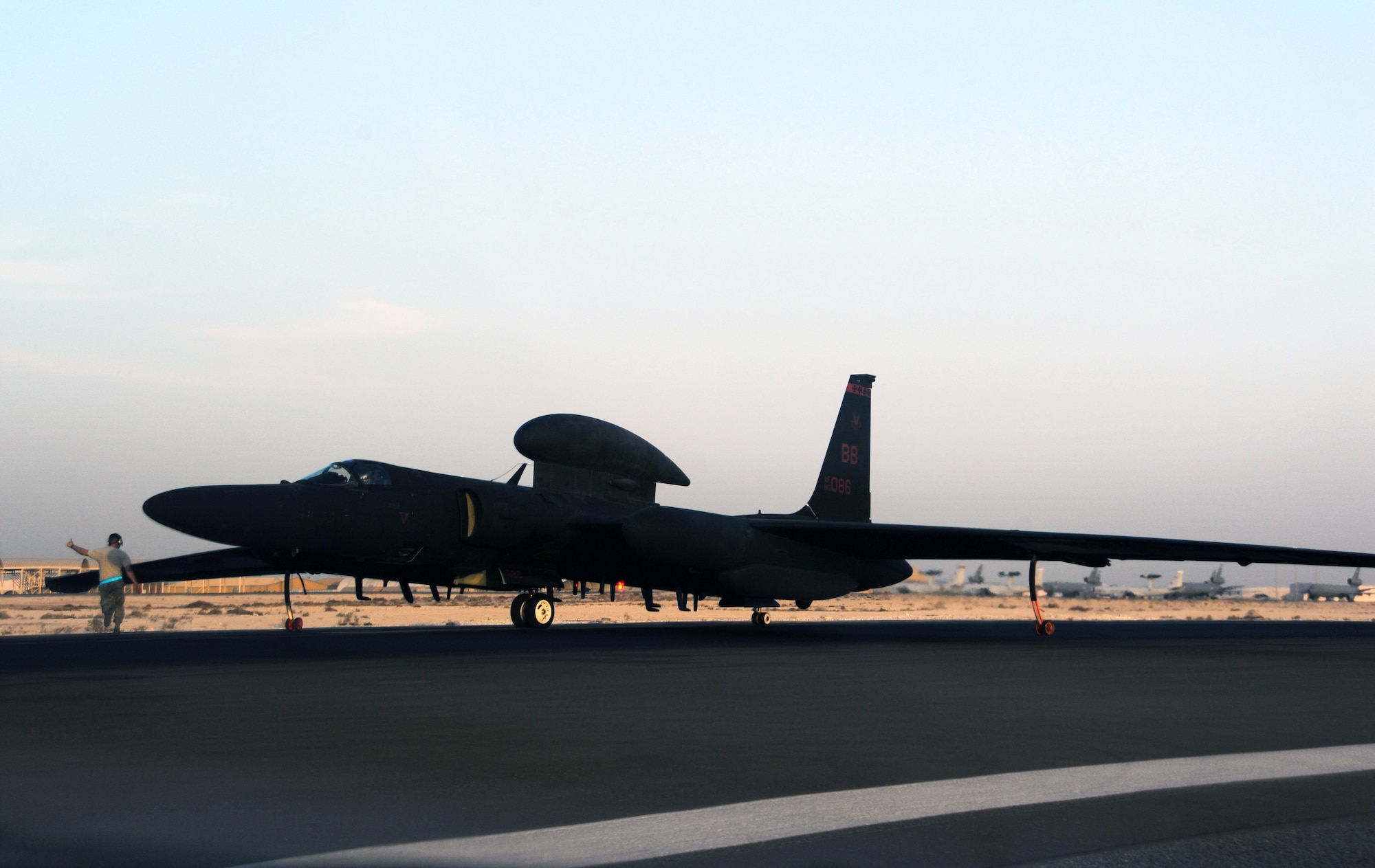 SOUTHWEST ASIA - A maintainer gives a thumbs-up as Maj. Mark prepares to taxi a U-2 back to its hangar Feb. 10, 2012. During the mission, Mark reached his 2,000th flying hour in the aircraft. He is deployed from Beale Air Force Base, Calif., to the 99th Expeditionary Reconnaissance Squadron. (U.S. Air Force photo/1st Lt. Victoria Porto)