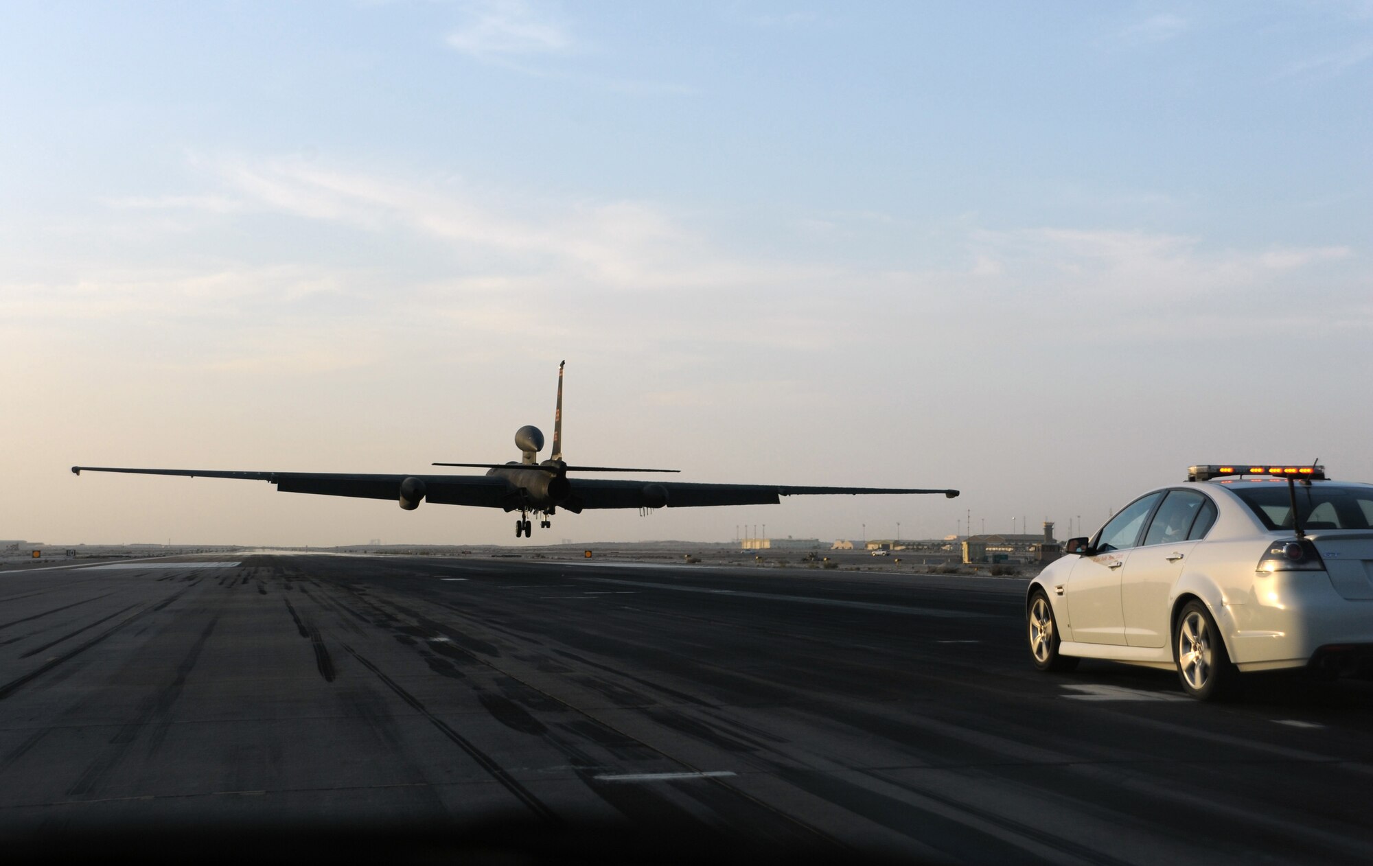 SOUTHWEST ASIA - Maj. Mark lands a U-2 as his wingman in a chase car follows along, guiding him to the runway Feb. 10, 2012. The pilot reached 2,000 flight hours in the aircraft during the mission. He is deployed from Beale Air Force Base, Calif., to the 99th Expeditionary Reconnaissance Squadron. (U.S. Air Force photo/1st Lt. Victoria Porto)