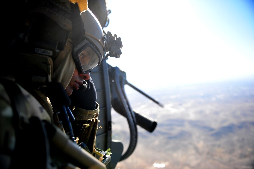 CAMP BASTION, Afghanistan -- Staff Sgt. Richard Dunn, a pararescuman assigned to to the 26th Expeditionary Rescue Squadron, sits aboard a HH-60G Pave Hawk helicopter while on a mission.The 26th ERQS compliments their traditional personnel recovery mission with medical evacuation operations in Afghanistan’s Regional Command Southwest. (U.S. Air Force photo by Senior Airman Tyler Placie)