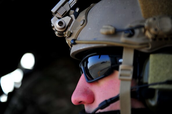 CAMP BASTION, Afghanistan -- A pararescueman from the 26th Expeditionary Rescue Squadron sits aboard a HH-60G Pave Hawk helicopter awaiting take off.The 26th ERQS compliments their traditional personnel recovery mission with medical evacuation operations in Afghanistan’s Regional Command Southwest. (U.S. Air Force photo by Senior Airman Tyler Placie)