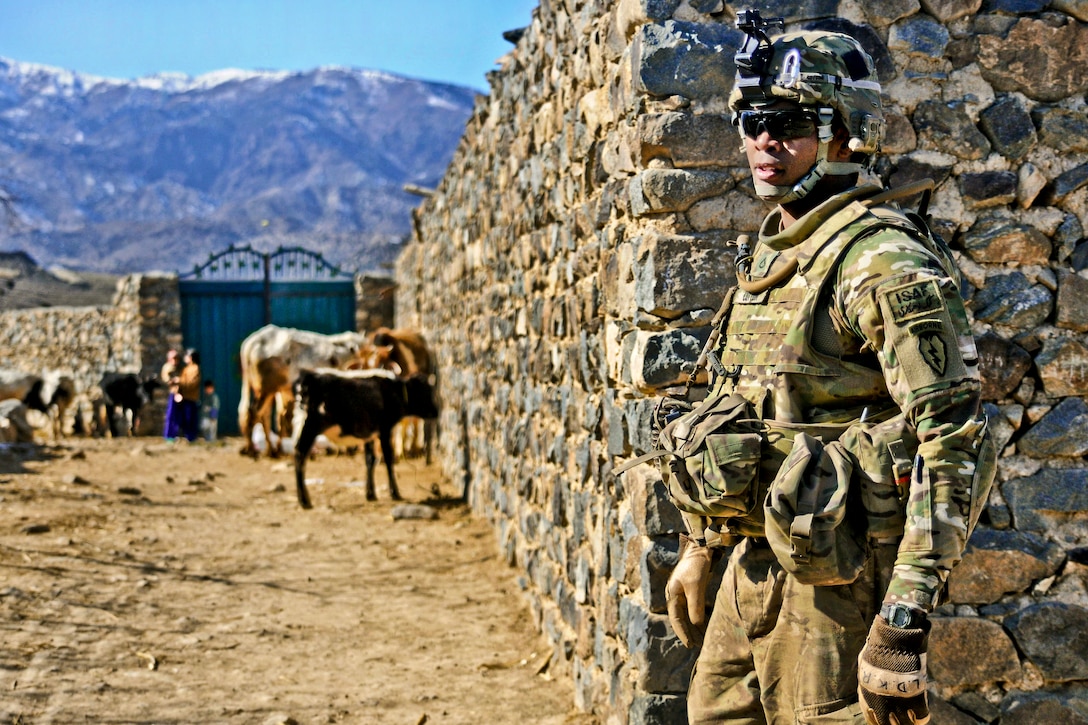 U.S. Army Spc. Bruce Cotton checks security near the village of Narizah in Afghanistan's Tani district, Feb. 10, 2012. Cotton is assigned to the 501st Infantry Division's Company B, 1st Battalion Airborne.