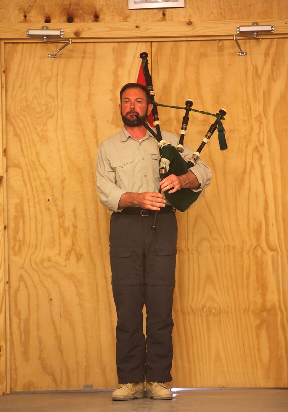 Retired Lt. Col. Patrick J. Carroll, the governance and cultural advisor for stability operations, Regional Command Southwest, plays “Amazing Grace” on his bagpipes during the memorial service for Lt. Col. Benjamin “Chili” Palmer aboard Camp Leatherneck, May 25. Palmer was killed while working with a mentoring team that provides support to 5th Brigade, Afghan National Civil Order Police, May 12.