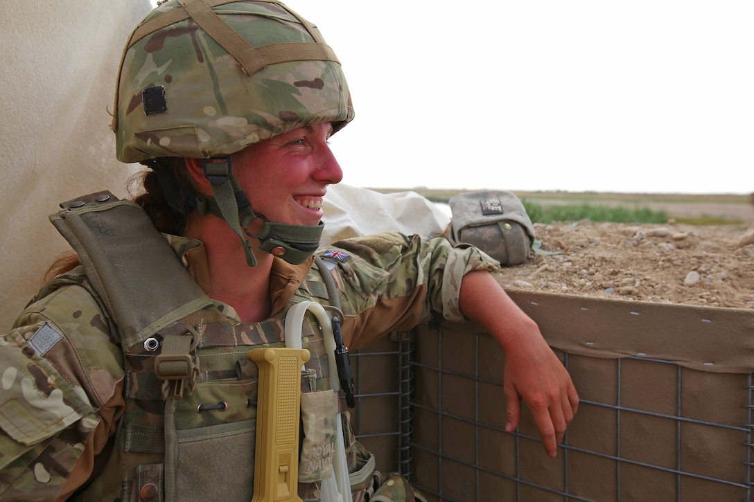 Able Seaman Heidi Telford relaxes next to the makeshift shelter that was built so she could privately search Afghan females for drugs or weapons as they crossed the Nahr-e-Bughra Canal, Helmand province, June 12. Telford, a native of Plymouth, U.K., is a member of the Female Engagement Team and is currently assigned to the 1 Rifles Battle Group in the Nahr-e-Saraj district. 