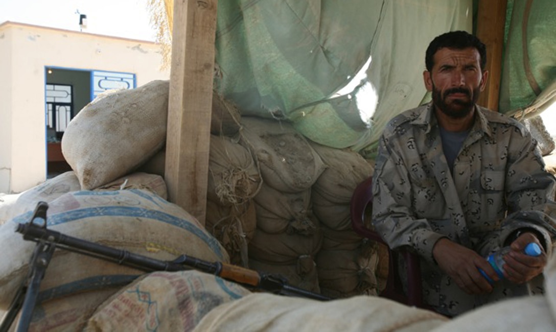 110619-N-XXXXS-038 LASHKAGAR (June 19, 2011) At the Bost airfield, Abdullah, an Afghan Border Patrolman, stands watch at a security checkpoint Sunday, June 19.  U.S. Marines with ? met with Afghan Border Police at different outposts such as this one to discuss security and logistical issues. (Official U.S. Navy photo by Mass Communication Specialist 2nd Class Matt Snodgrass/Released)