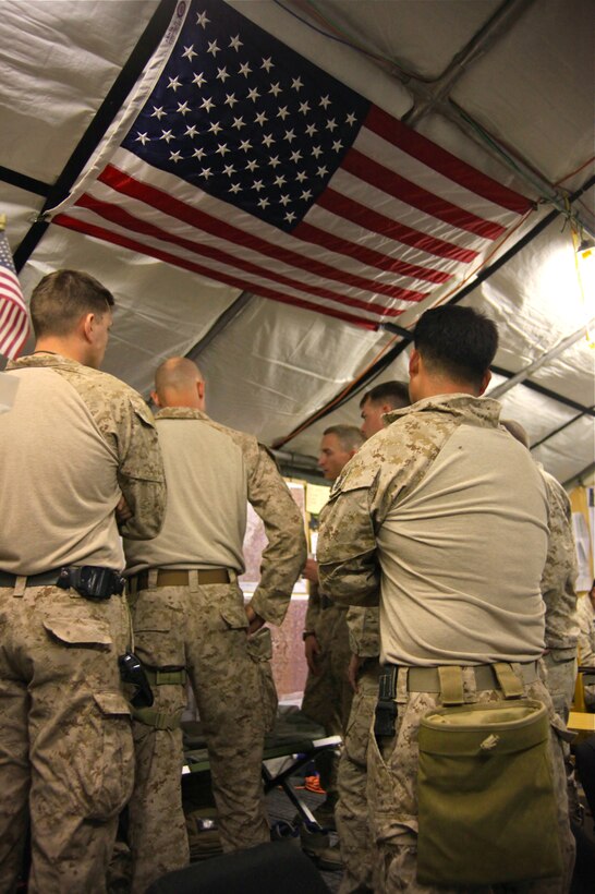 CAMP LEATHERNECK, Afghanistan-Leaders from 1st Brigade, 5th Air Naval Gunfire Liaison Company and 1st Brigade, 1st ANGLICO gather around maps of the area of operations aboard Mobile Operating Base Price to discuss how 5th ANGLICO will take the reigns from 1st ANGLICO Nov. 28. The Marines talked about things such as the successes of 1st ANGLICO as well as major concerns to be aware of in the future.