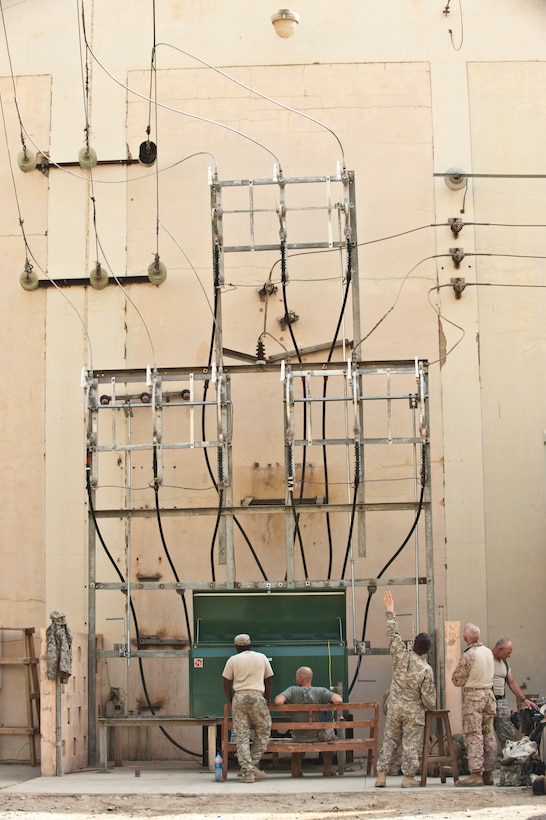 110711-N-TH989-083 KAJAKI, Afghanistan. (July 11, 2011) Technicians with the U.S. Army Corps of Engineers and Afghan engineers assigned to the Kajaki hydroelectric power plant check the recently built electrical grid in the vicinity of the dam.  The U.S. Army Corps of Engineers’ Afghanistan Engineer District-South and Afghan engineers recently completed installation of a primary switch center at the Kajaki dam to resolve electrical problems. (U.S. Navy photo by Mass Communication Specialist 2nd Class Jonathan David Chandler/Released)