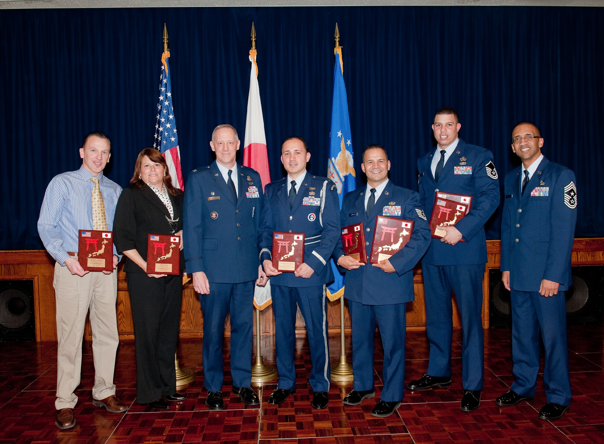 YOKOTA AIR BASE, Japan -- The winners of the 374th Airlift Wing Team Yokota 4th Quarterly Awards pose for a photo at the awards ceremony, Feb. 14, 2012 at Yokota Air Base, Japan. (U.S. Air Force photo/Osakabe Yasuo)