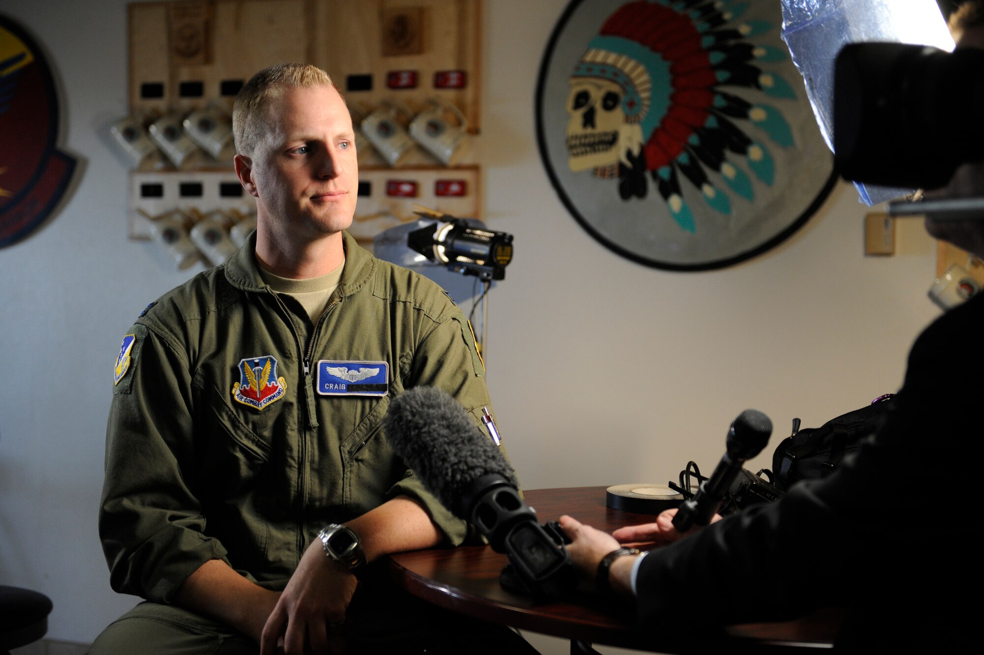 HOLLOMAN AIR FORCE BASE, N.M. -- U.S. Air Force Capt. Craig (last name withheld), a 6th Reconnaissance Squadron MQ-1 Predator instructor pilot, speaks to the British Broadcasting Corporation during a media visit to Holloman Air Force Base, N.M., Feb. 9. Local and international visited Holloman to discuss the training mission here and the capabilities of remotely piloted aircraft. Last names of the RPA crew members are withheld due to operational security constraints. (U.S. Air Force photo by Staff Sgt. Carolyn Herrick/Released)