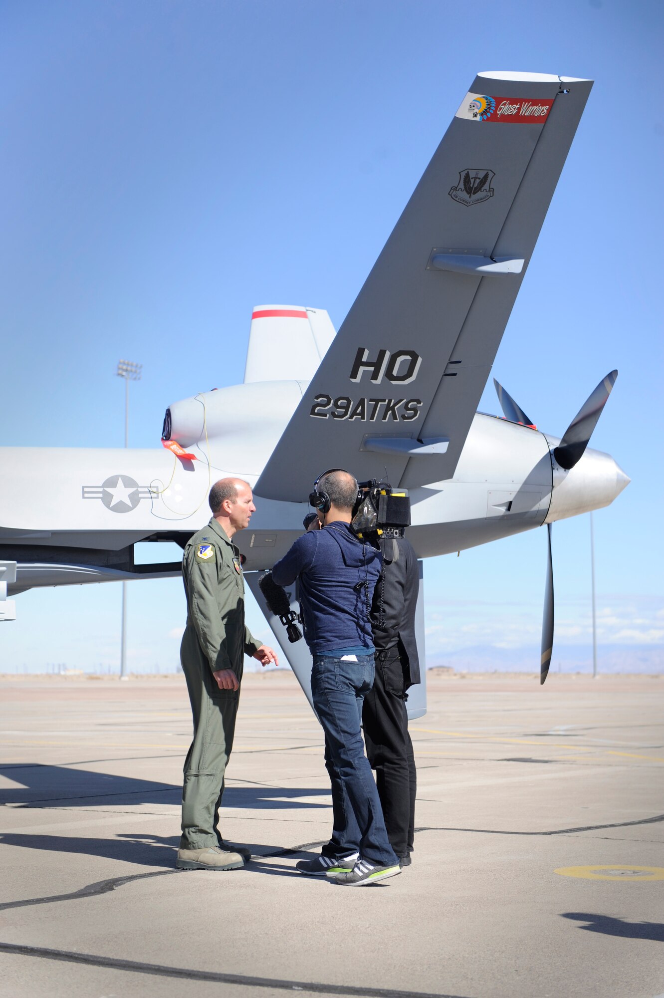 HOLLOMAN AIR FORCE BASE, N.M. -- U.S. Air Force Col. Ken Johnson, 49th Operations Group commander, speaks with international media in front of an MQ-9 Reaper on the flightline here Feb. 9. Local and international media visited Holloman to discuss the base's training mission and the capabilities of remotely piloted aircraft. Holloman is a training base for both the MQ-1 Predator and the MQ-9 Reaper. (U.S. Air Force photo by Staff Sgt. Carolyn Herrick/Released)