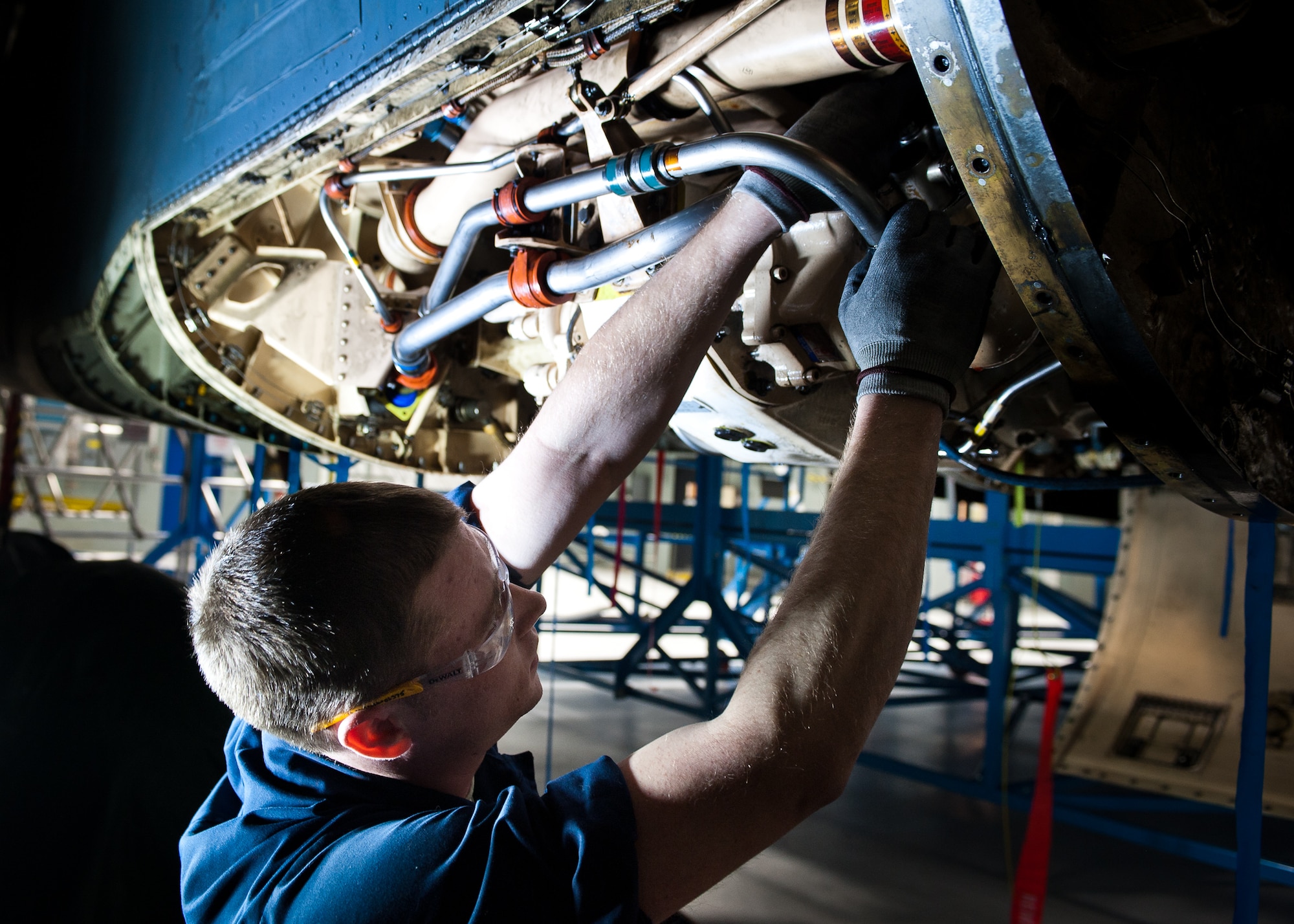 Senior Airman James Chazotte, 28th Maintenance Squadron aircraft metal technology apprentice, replaces a hydraulic line on A B-1B during an isochronal inspection at Ellsworth Air Force Base, S.D., Feb. 8, 2012. The isochronal inspection shop disassembles the aircraft and inspects all critical systems after a specified number of flight hours, or if the aircraft is having technical issues. (U.S. Air Force photo by Airman Alystria Maurer/Released)