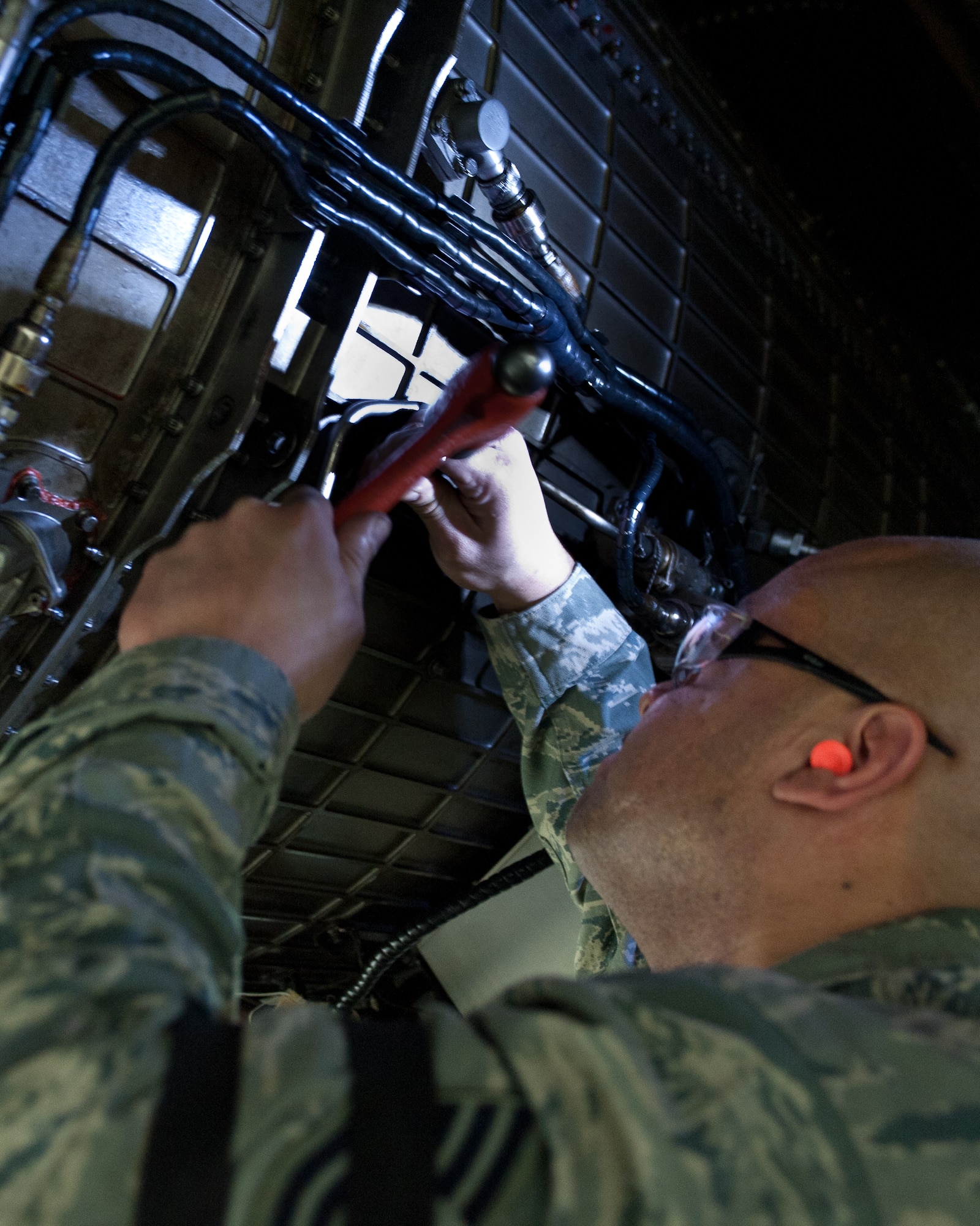 Tech. Sgt Mathia Renken, 28th Maintenance Squadron metals technology craftsman, replaces a keylocking thread insert on an B-1B engine during an isochronal inspection at Ellsworth Air Force Base, S.D., Feb. 8, 2012. These thread inserts strengthen and secure operation critical aircraft parts, which must be taken out for inspection and reinstalled once the inspection is complete. (U.S. Air Force photo by Airman Alystria Maurer/Released)