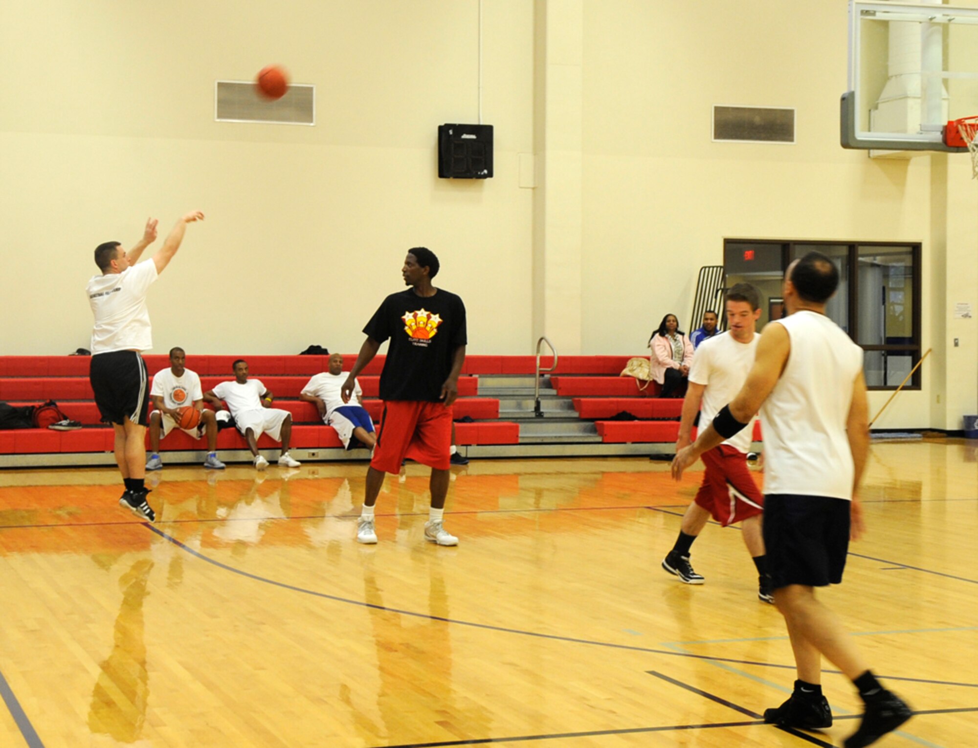 VANDENBERG AIR FORCE BASE, Calif. – Chaplain Shane Walker from the 30th Space Wing drains a 3-pointer over A.C. Green, a motivational speaker and retired National Basketball Association player, during the bi-weekly Gospel Basketball Men’s Fellowship here Sunday, Feb. 12, 2012.  The fellowship is held every other Sunday at 2:30 p.m. in the base gym. For more information contact the Vandenberg Air Force Base chapel staff at 606-5773. (U.S. Air Force photo/Tech. Sgt. Scottie T. McCord) 